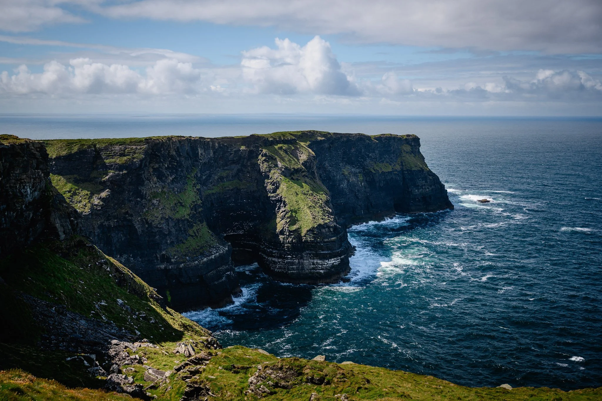The dramatic sea cliffs and Atlantic view at Hag's Head, the southern end of the Cliffs of Moher, County Clare, on a bright day