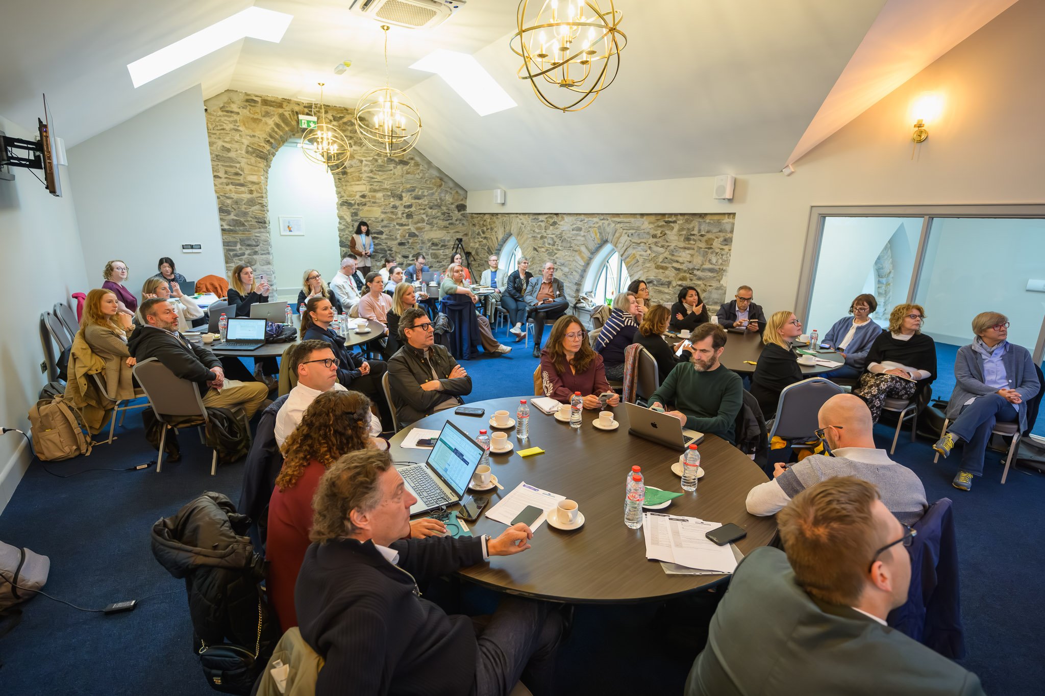 Delegates seated at round tables during a working session at FutureCast in Manorhamilton, Co. Leitrim, for the Western Development Commission REWARD conference