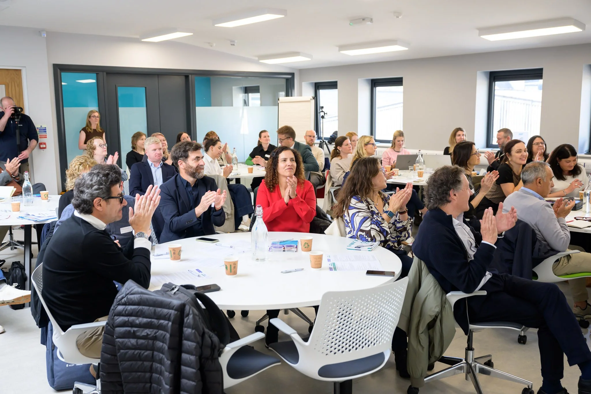 Delegates applauding at round tables during a session at the Western Development Commission REWARD conference in Sligo