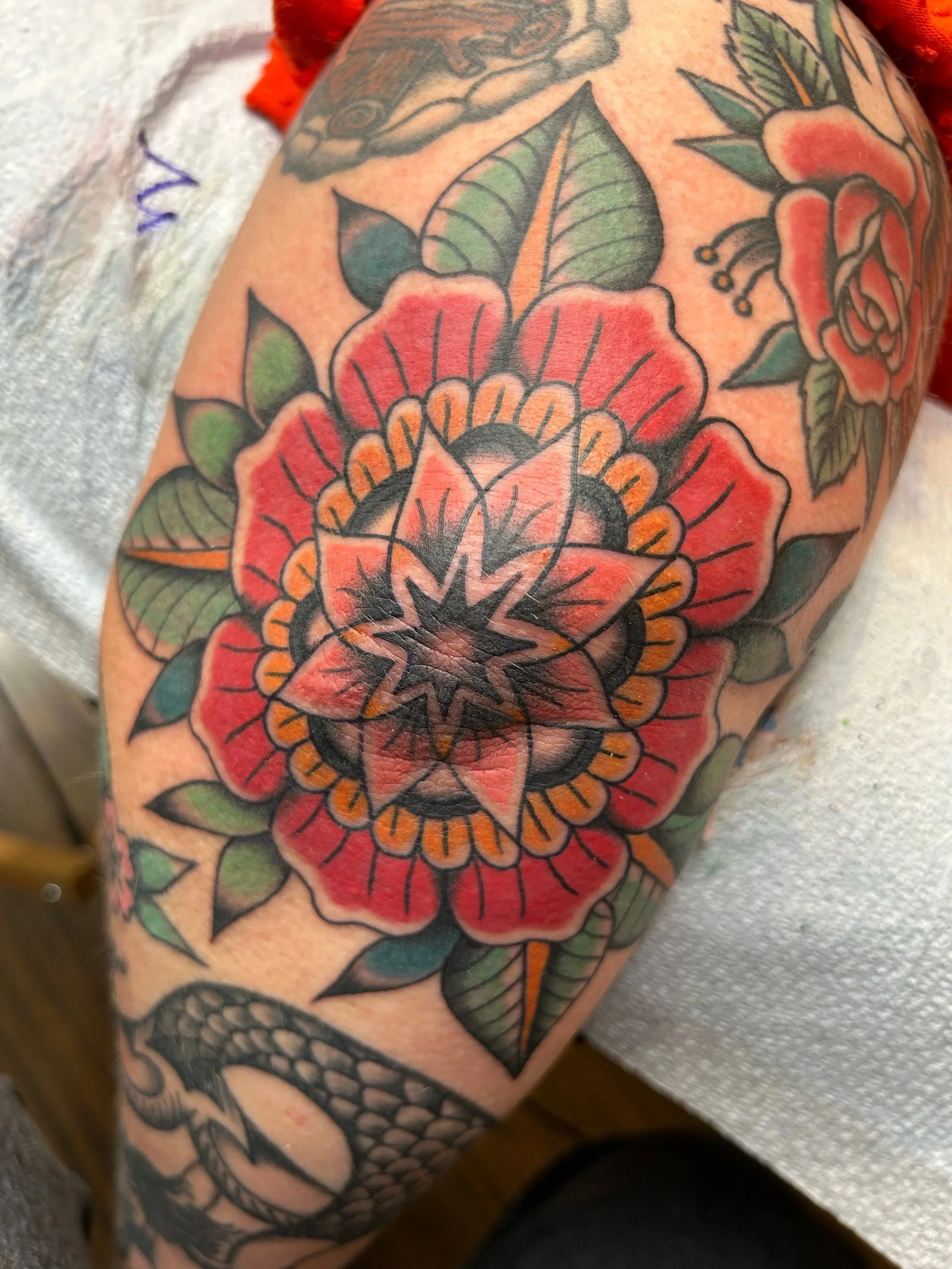 My awesome client gave me the idea to make her a floral mandala piece in some colors we had really been loving on her for her elbow piece. I can’t believe we’re almost tattooed her whole body now.