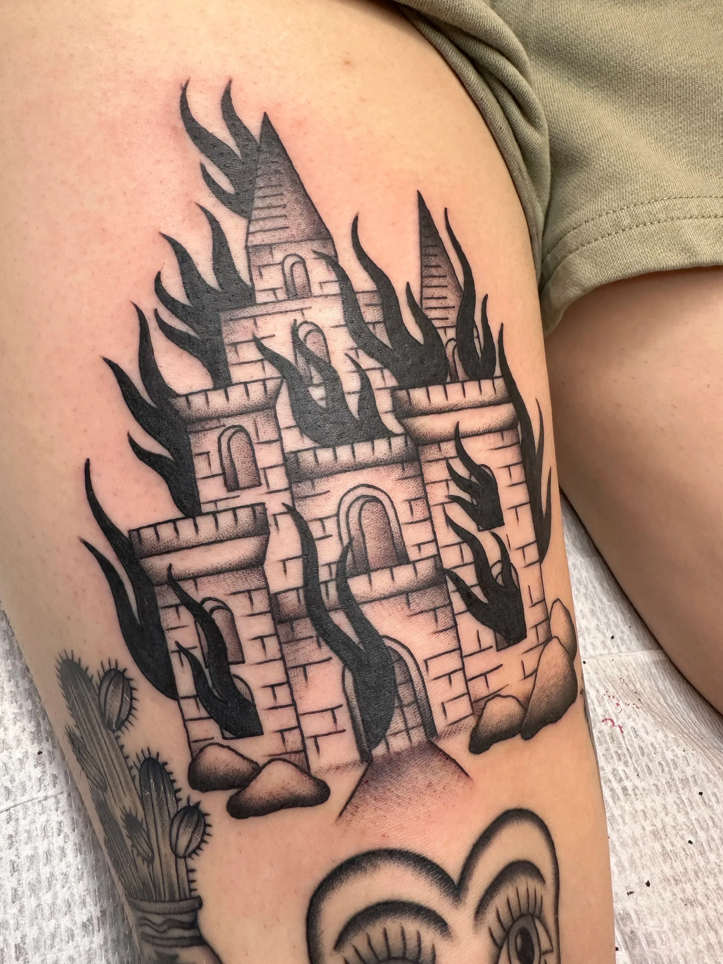 Same client who wanted his whole leg tattooed in two months came in with a neat burning church design, so I made it a little less sacrilegious and created a burning castle instead.