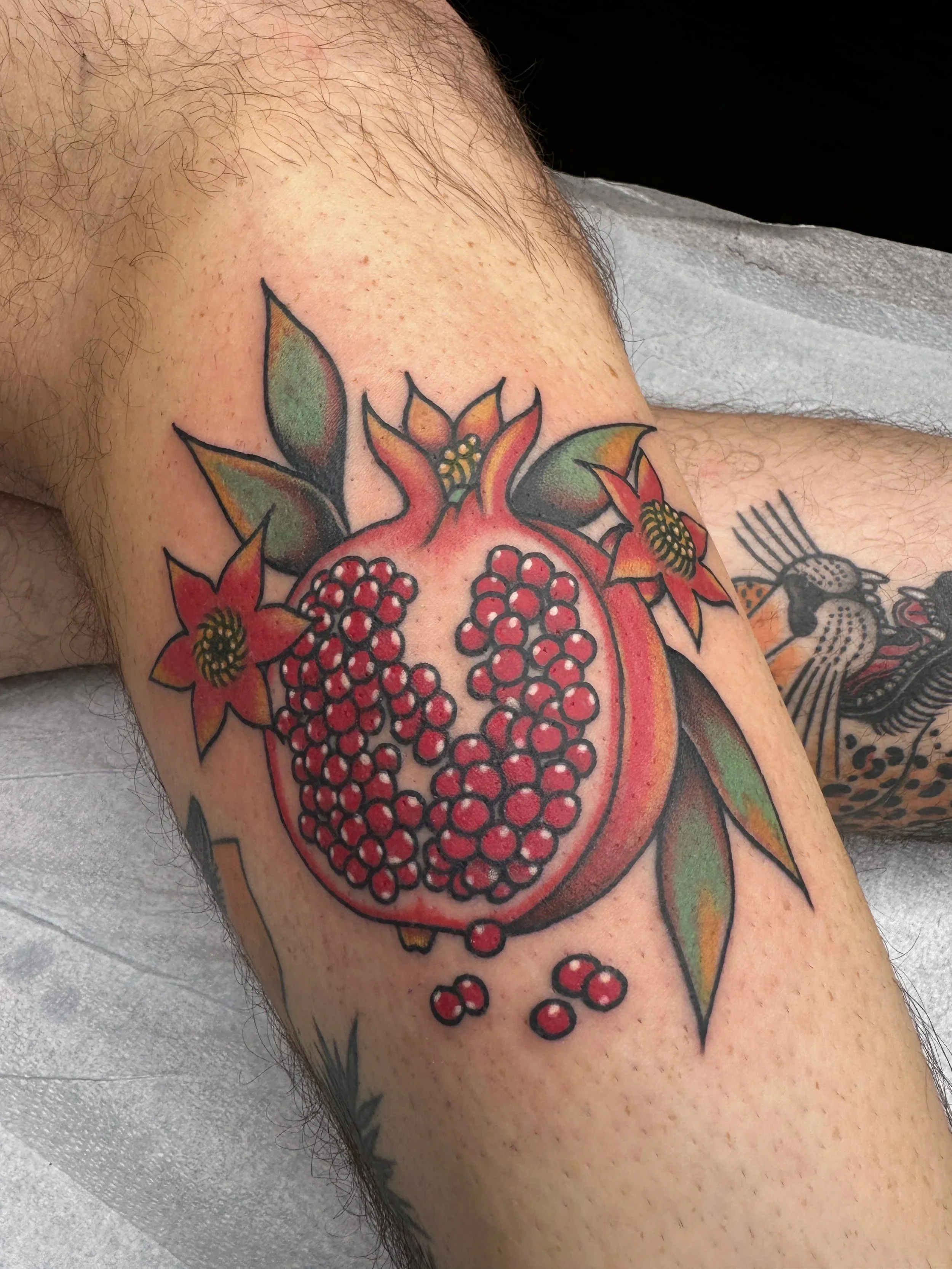 Pretty cool colorful pomegranate tattoo for my amazing client who refuses to get tattooed by anyone but me. I love it.