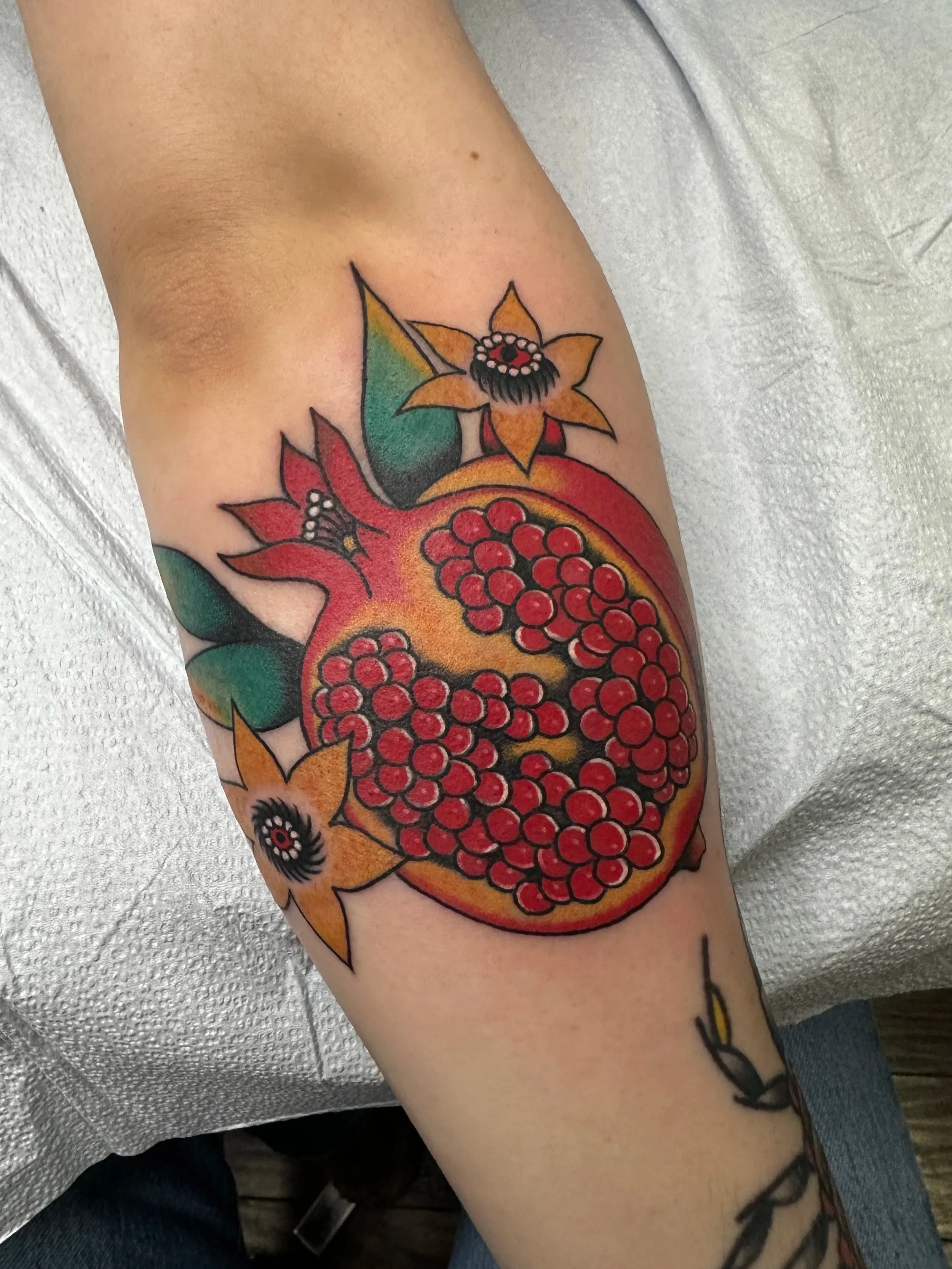 Sometimes my clients see someone get a cool tattoo and want the same thing. I will oblige, but I do change it up a bit so they’re not totally the same. This client loved the other pomegranate I made so I made one similar just for them.