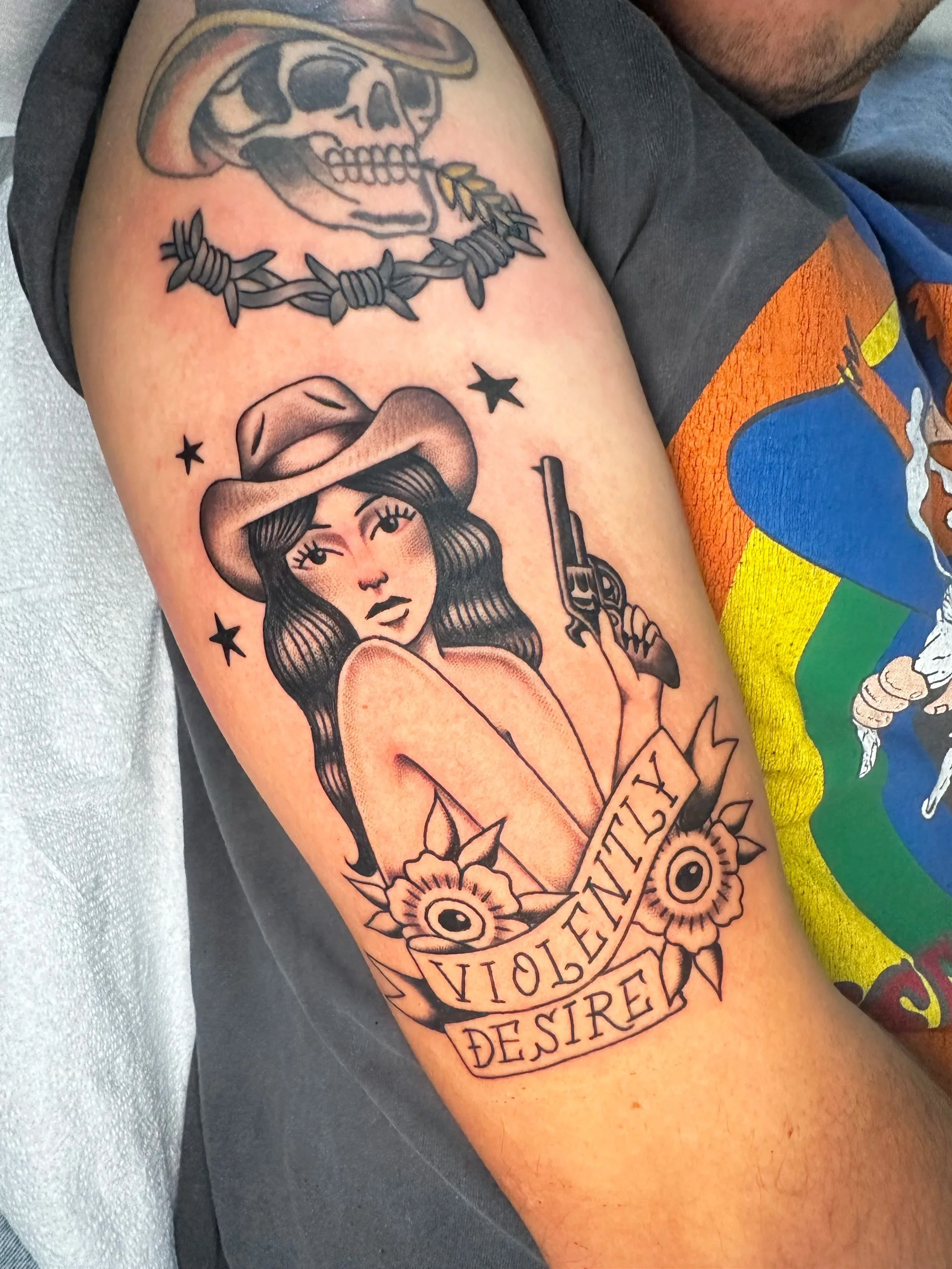 This black and grey cowgirl tattoo was base do a drawing my first time client came in with during is consultation. He drew it himself, I just made a few adjustments and laid it down. 