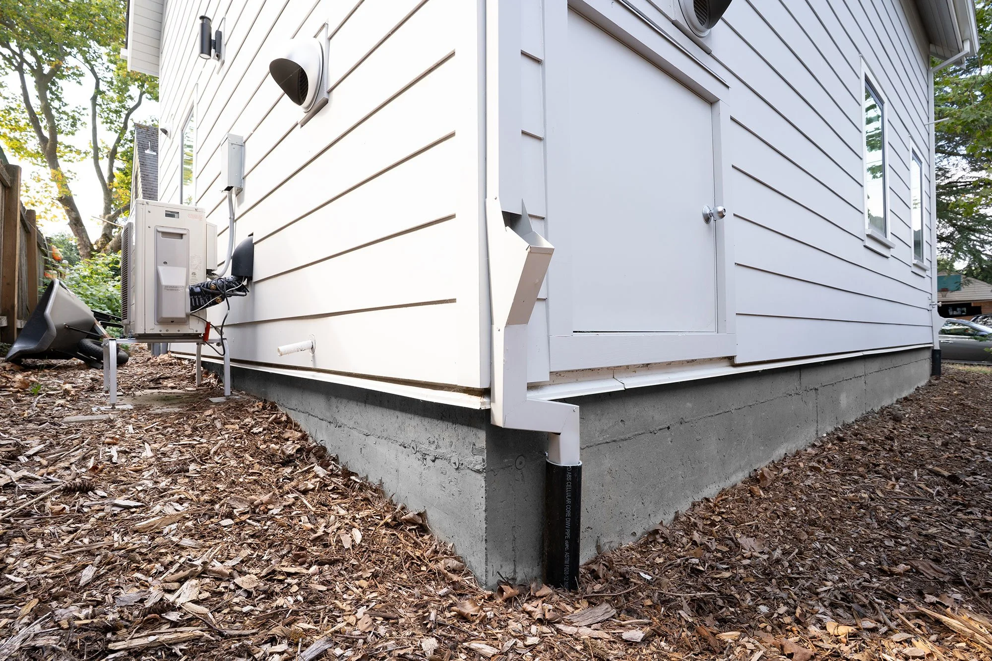 Concrete foundation with house built on top