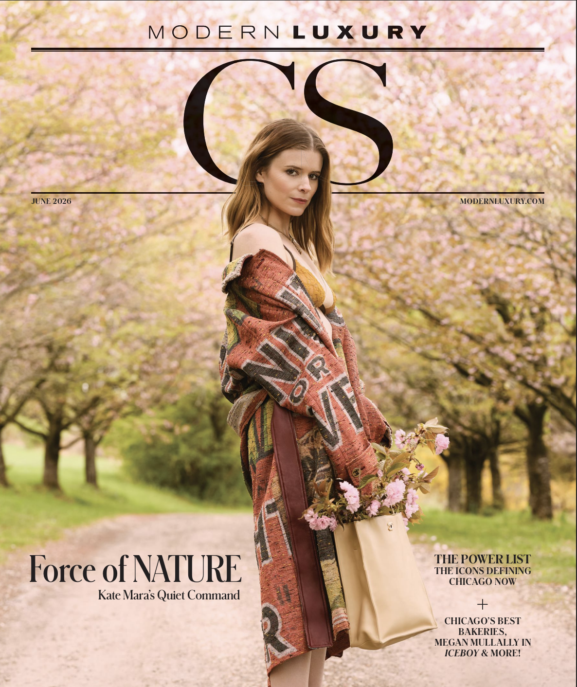 Magazine cover featuring a woman standing on a pink blossom-lined pathway holding a bouquet of pink flowers and a beige tote bag. The background is filled with blooming trees, and the magazine title 'Modern Luxury' is at the top. Headlines include 'Force of Nature' and references to Chicago's top bakeries and iconic landmarks.
