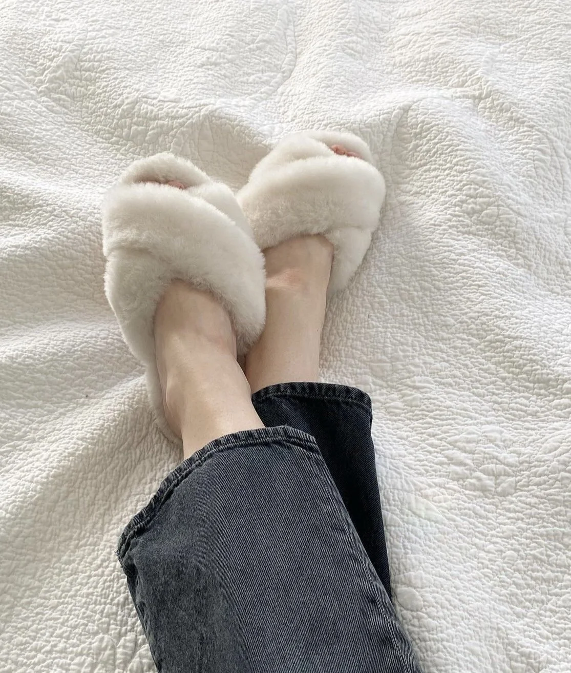 mom wearing cozy slippers while relaxing as baby sleeps