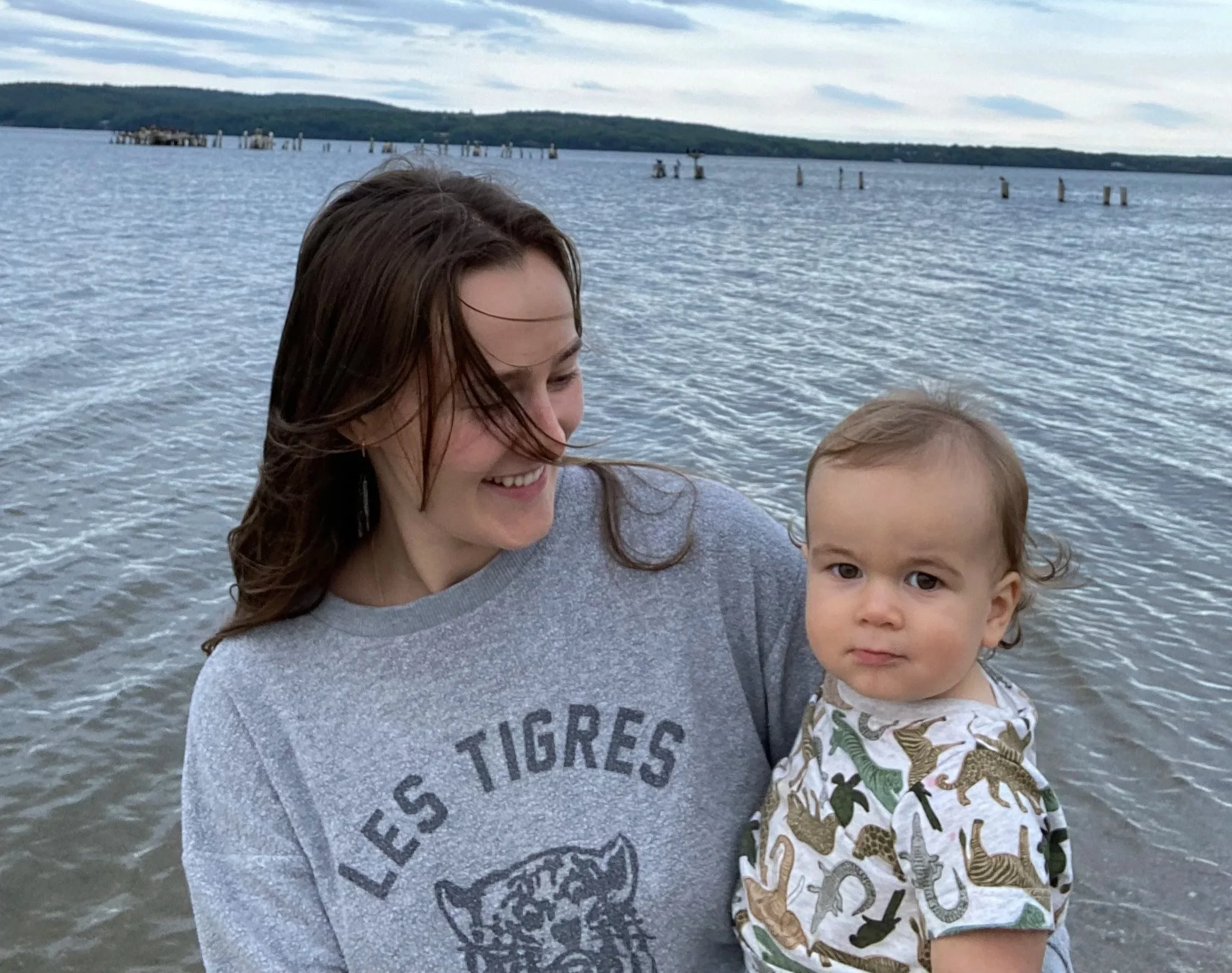 mom and baby by the water in Maine