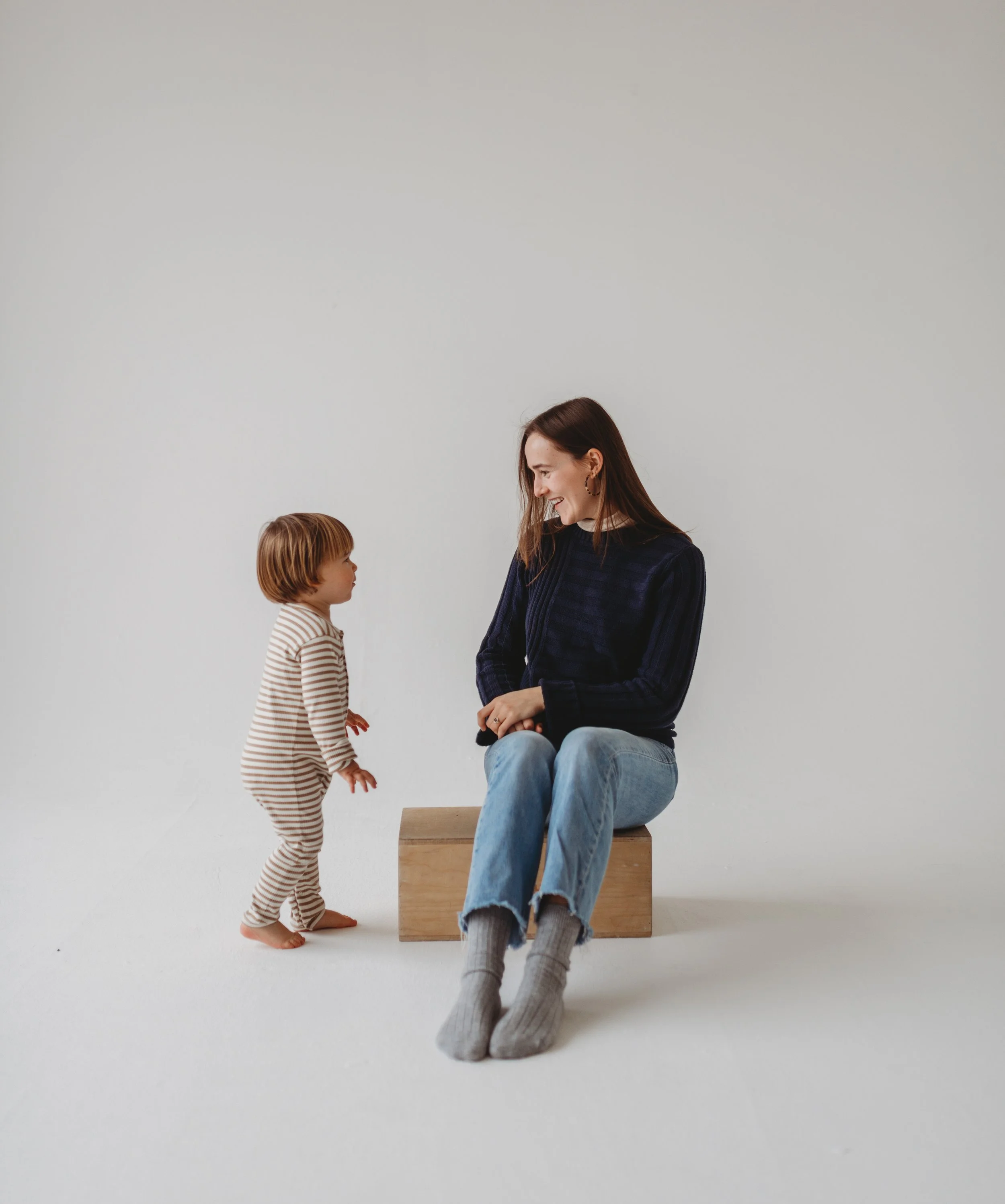 Baby sleep consultant, Ella, sitting with son and sharing the baby sleep consulting services and sleep support she offers