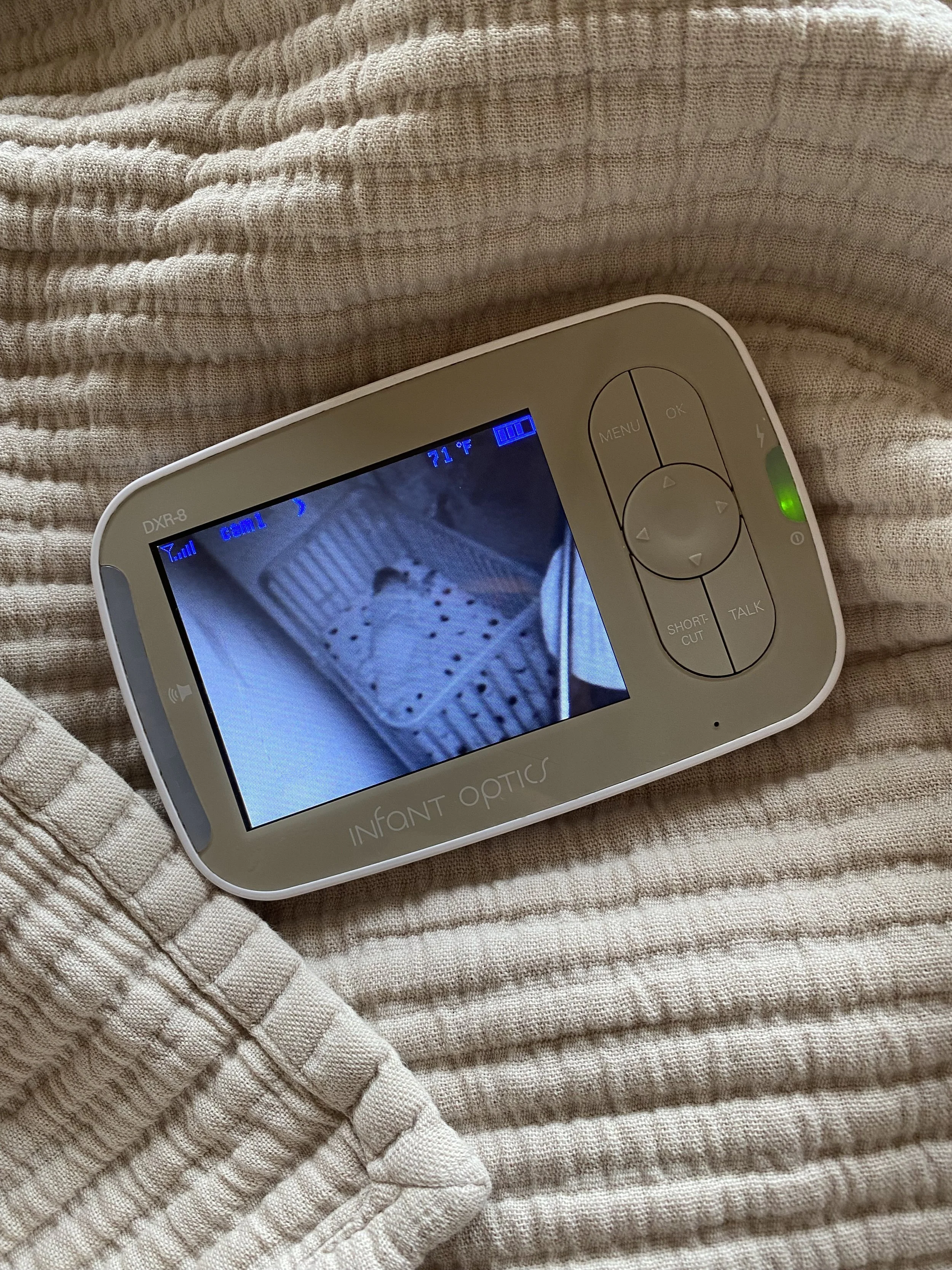 Baby monitor showing a napping baby at NYC home