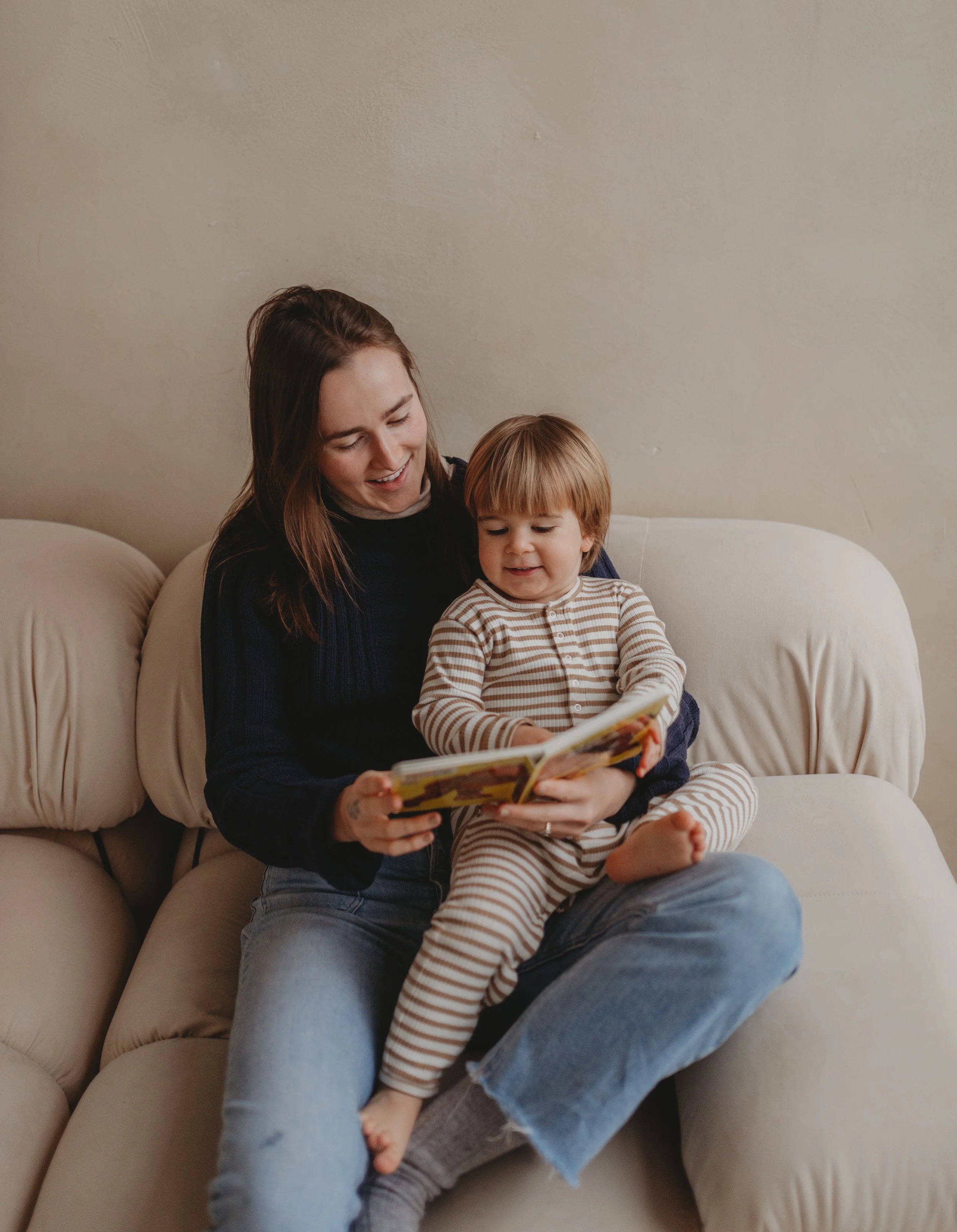 Ella Grace, sleep consultant for babies in new york city reading to her child