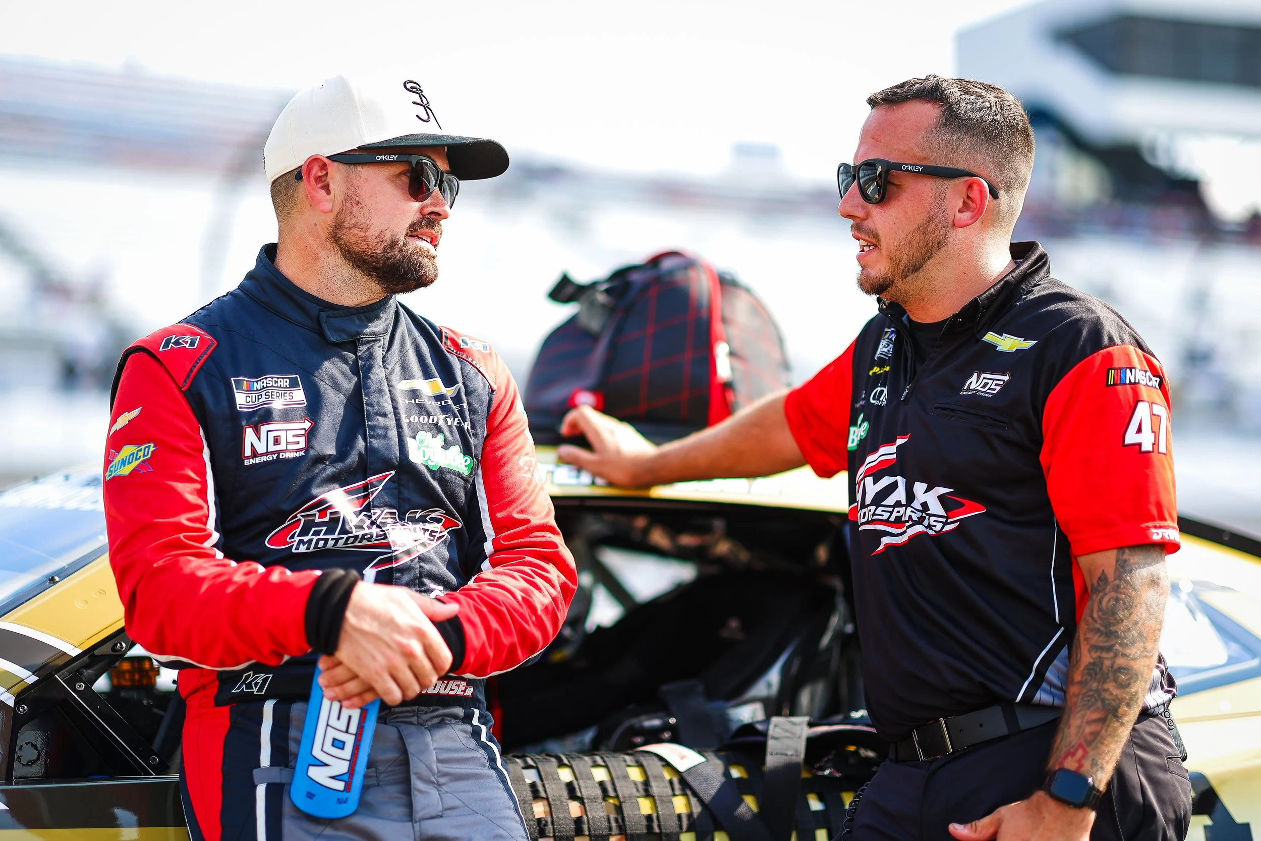 Ricky Stenhouse Jr. talks with his pit crew before the Cook Out 400 at Richmond Speedway