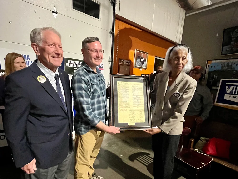  Admiral Abbot and Ambassador Courville presenting Eugene Vindman with a framed copy of the U.S. Constitution 