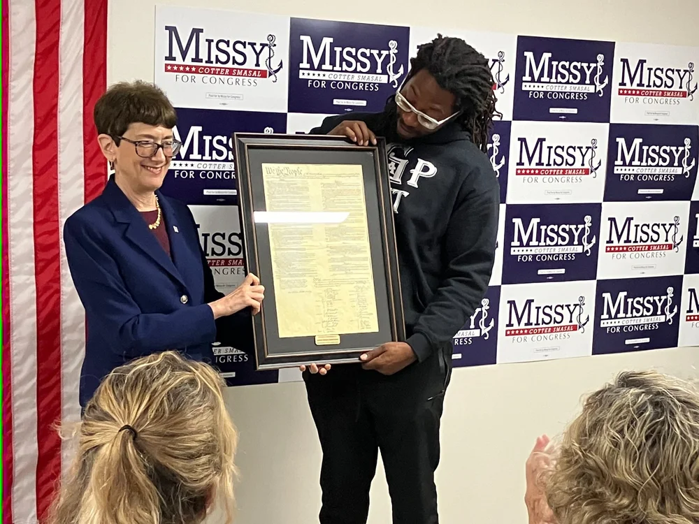  Retired Ambassador Judith Cefkin presenting framed U.S. Constitution for Missy Cotter-Smasal to campaign staffer on her behalf 