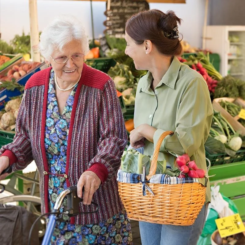 Caregiver grocery shopping with client