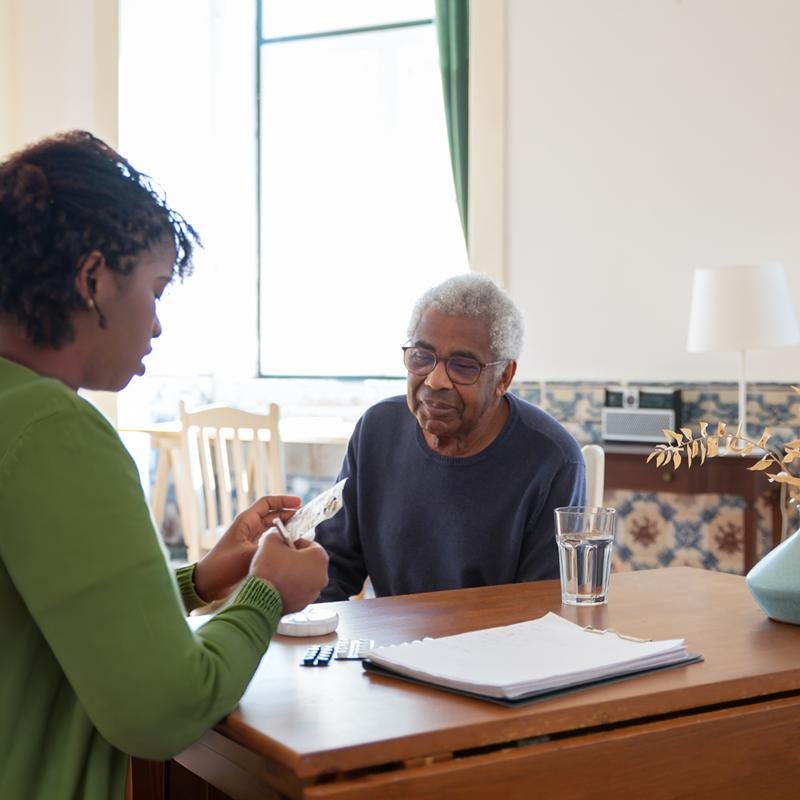 Medicine Reminders being given to client by caregiver