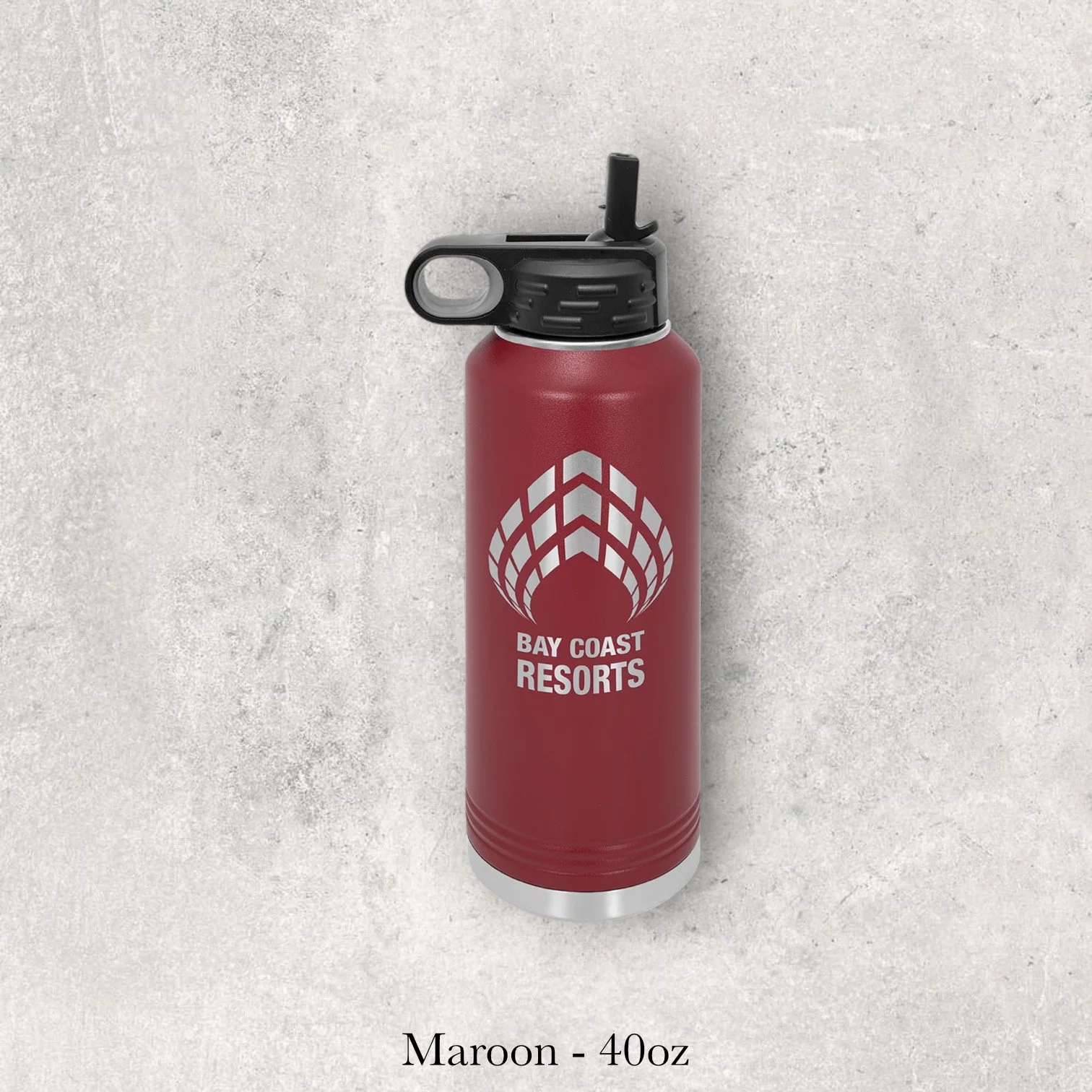 Maroon 40oz metal water bottle engraved by Lazeric with a resort-style logo featuring a pinecone emblem.