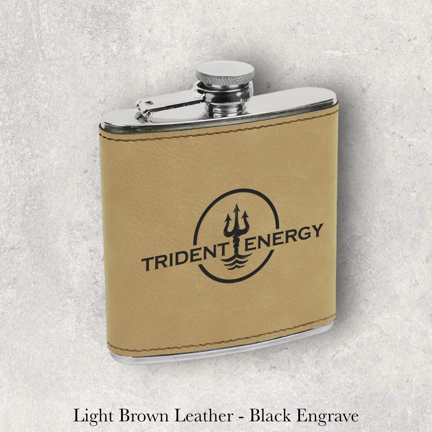 Light brown leather 6oz flask with Trident Energy logo, black laser engraving, engraved by Lazeric
