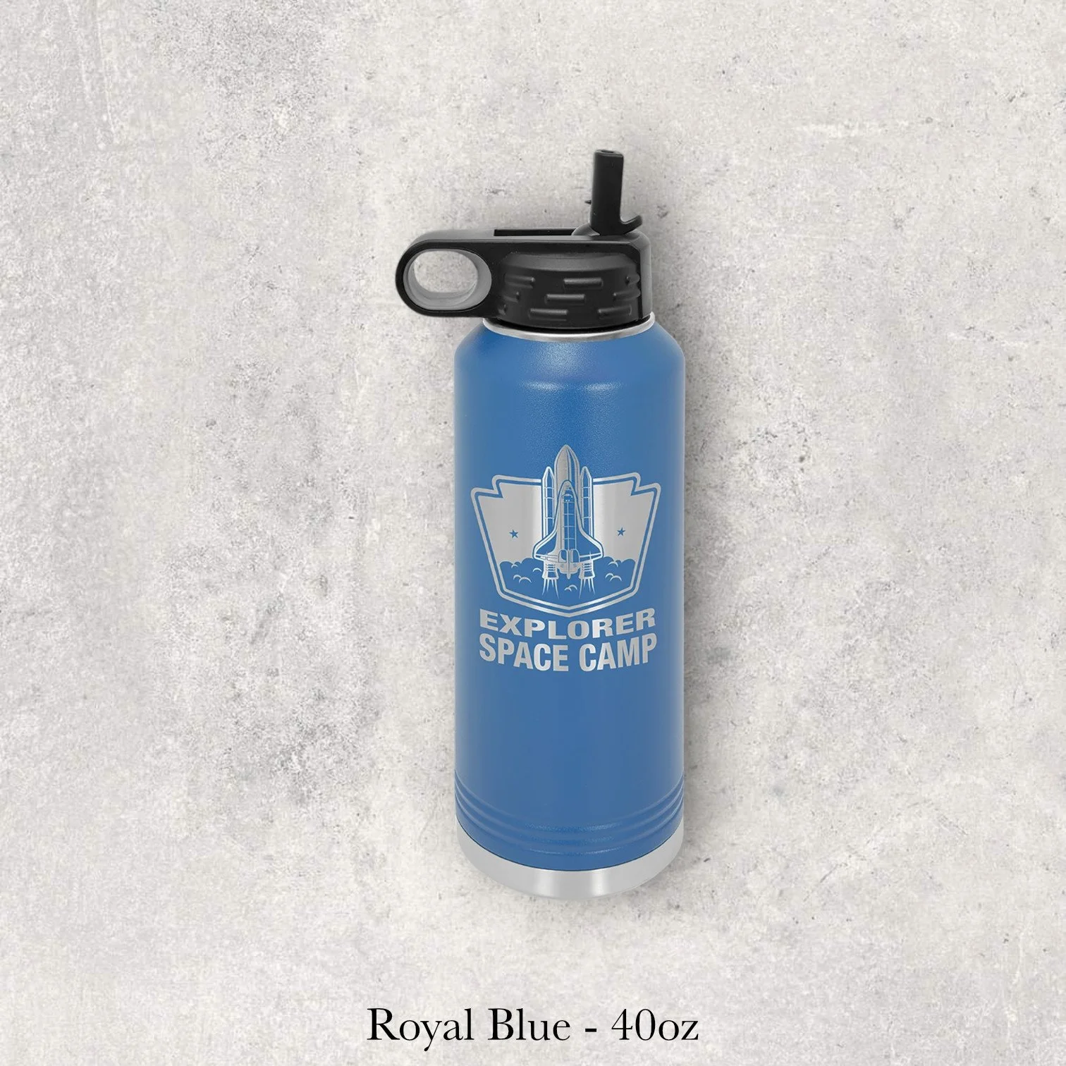 Royal blue 40oz metal water bottle engraved by Lazeric featuring a space camp logo with a rocket and shield design.