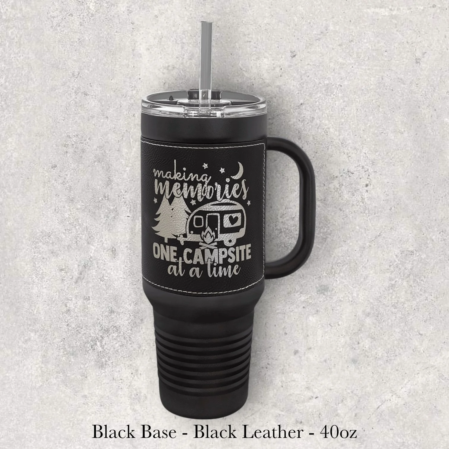 Black base black leather 40oz travel mug with camping trailer and “making memories one campsite at a time” design, engraved by Lazeric