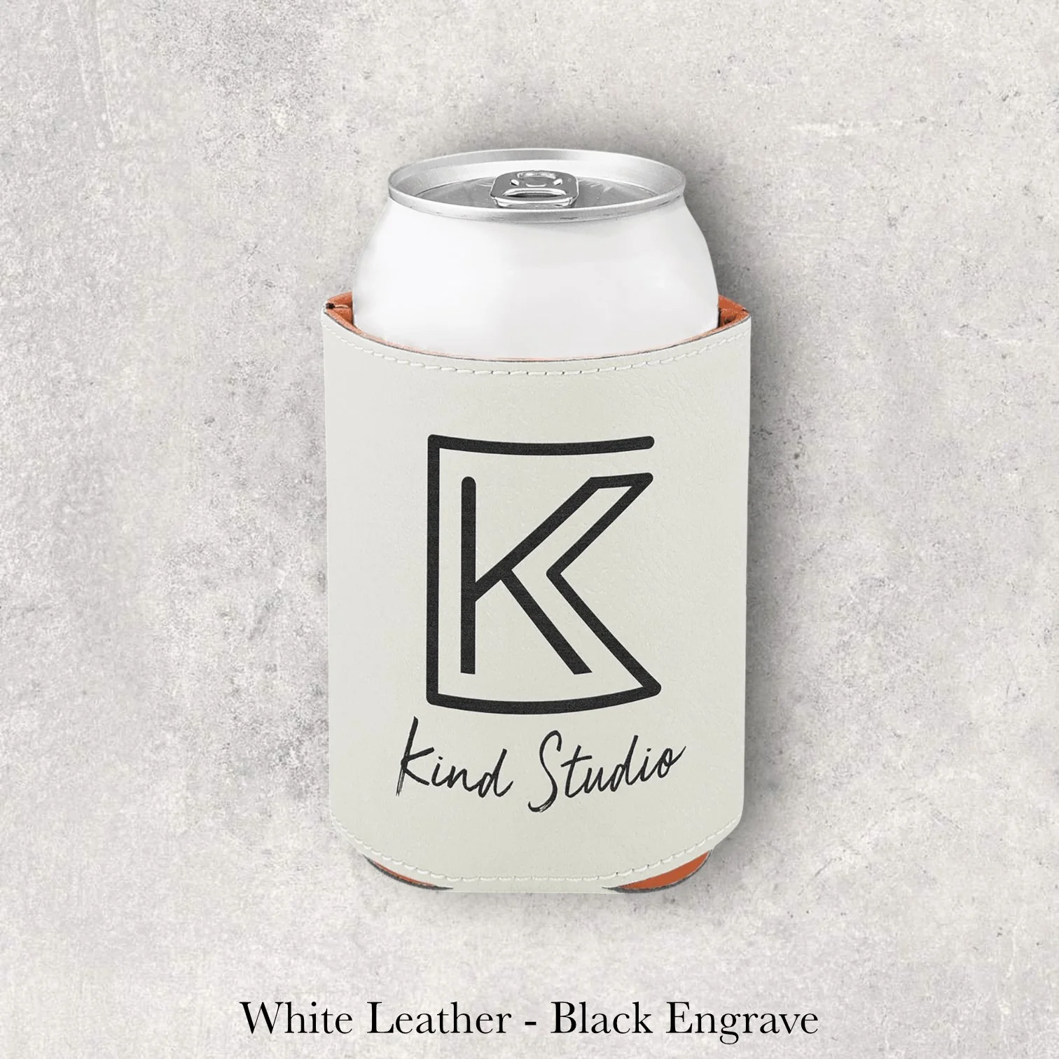 Laser engraved white leather can coozie with Kind Studio logo, engraved by Lazeric