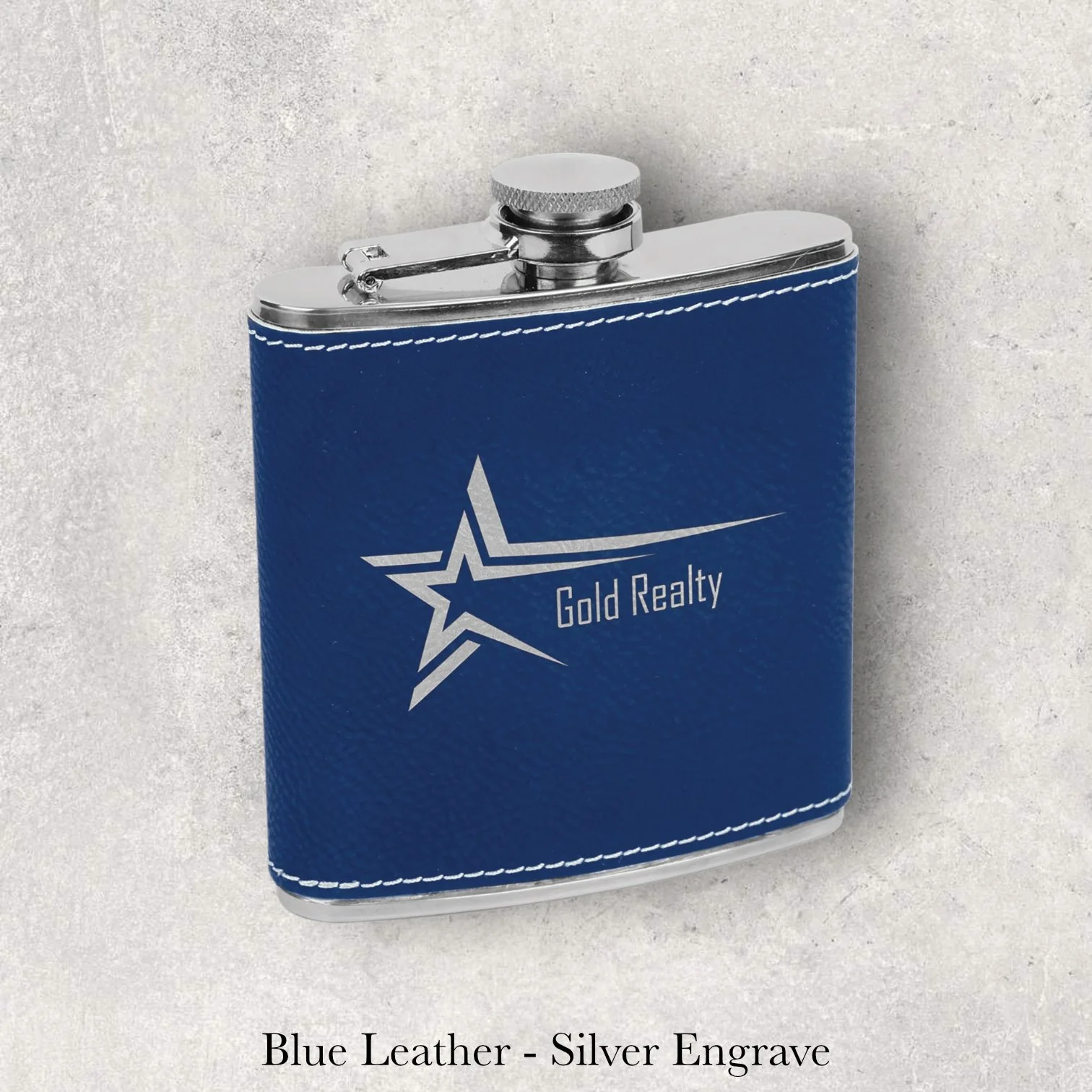 Blue leather 6oz flask with Gold Realty star logo, silver laser engraving, engraved by Lazeric
