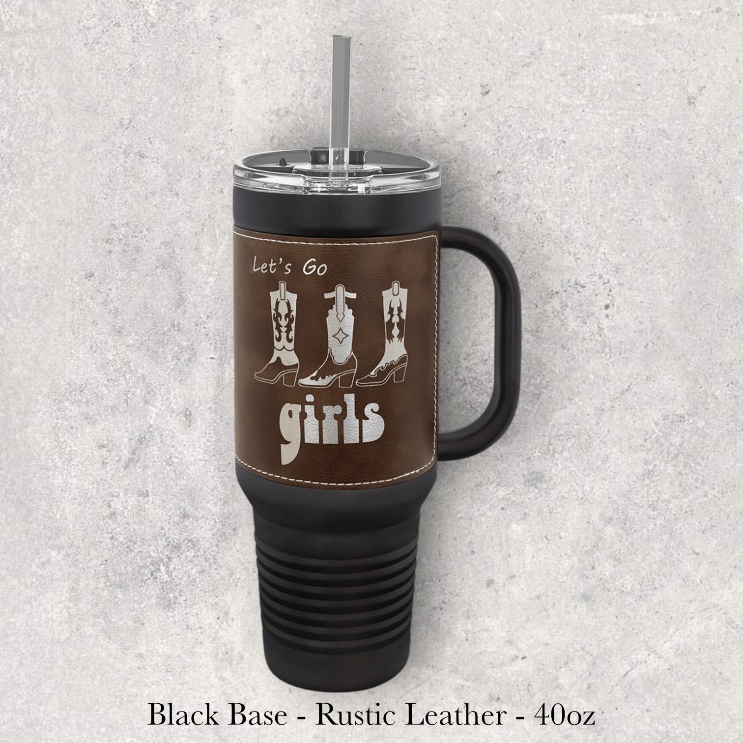 Black base rustic leather 40oz travel mug with western boots graphic and “let’s go girls” text, engraved by Lazeric