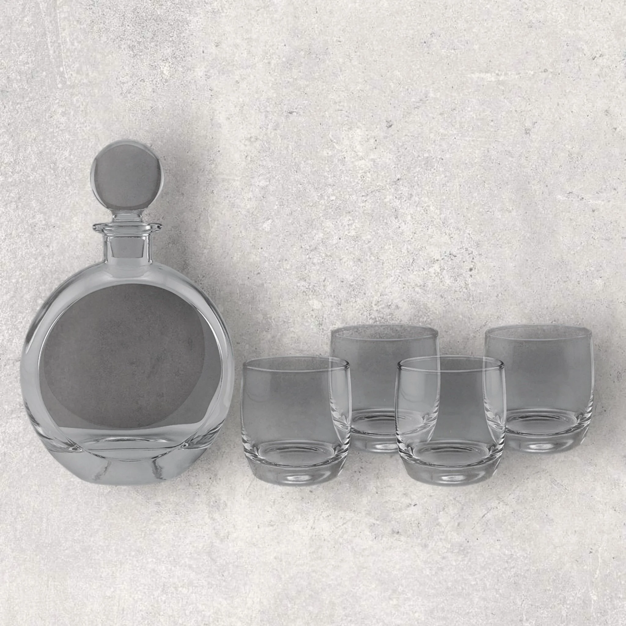 Blank round glass decanter and four rocks glasses ready for engraving, shown unengraved by Lazeric