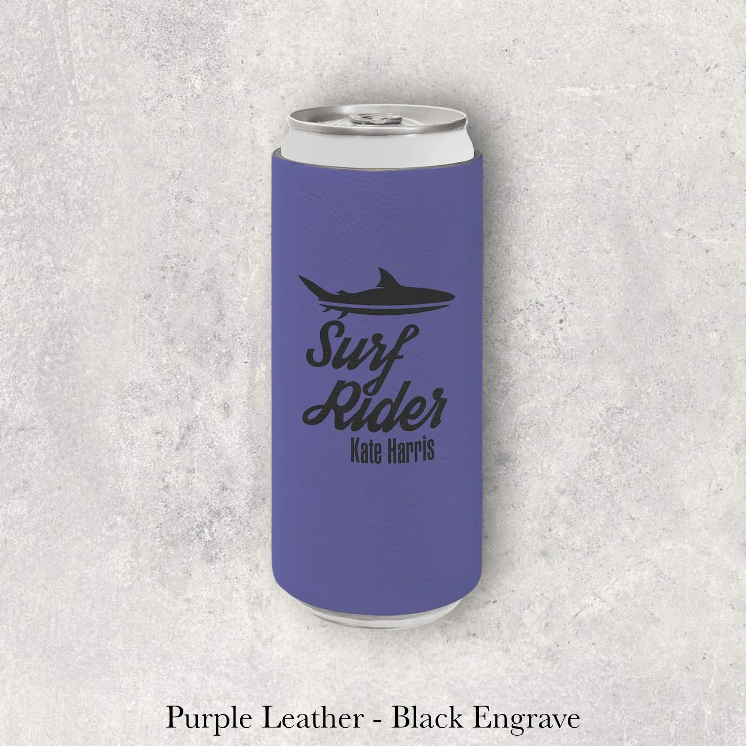 Purple leather slim can coozie with black laser-engraved Surf Rider shark logo and name, engraved by Lazeric