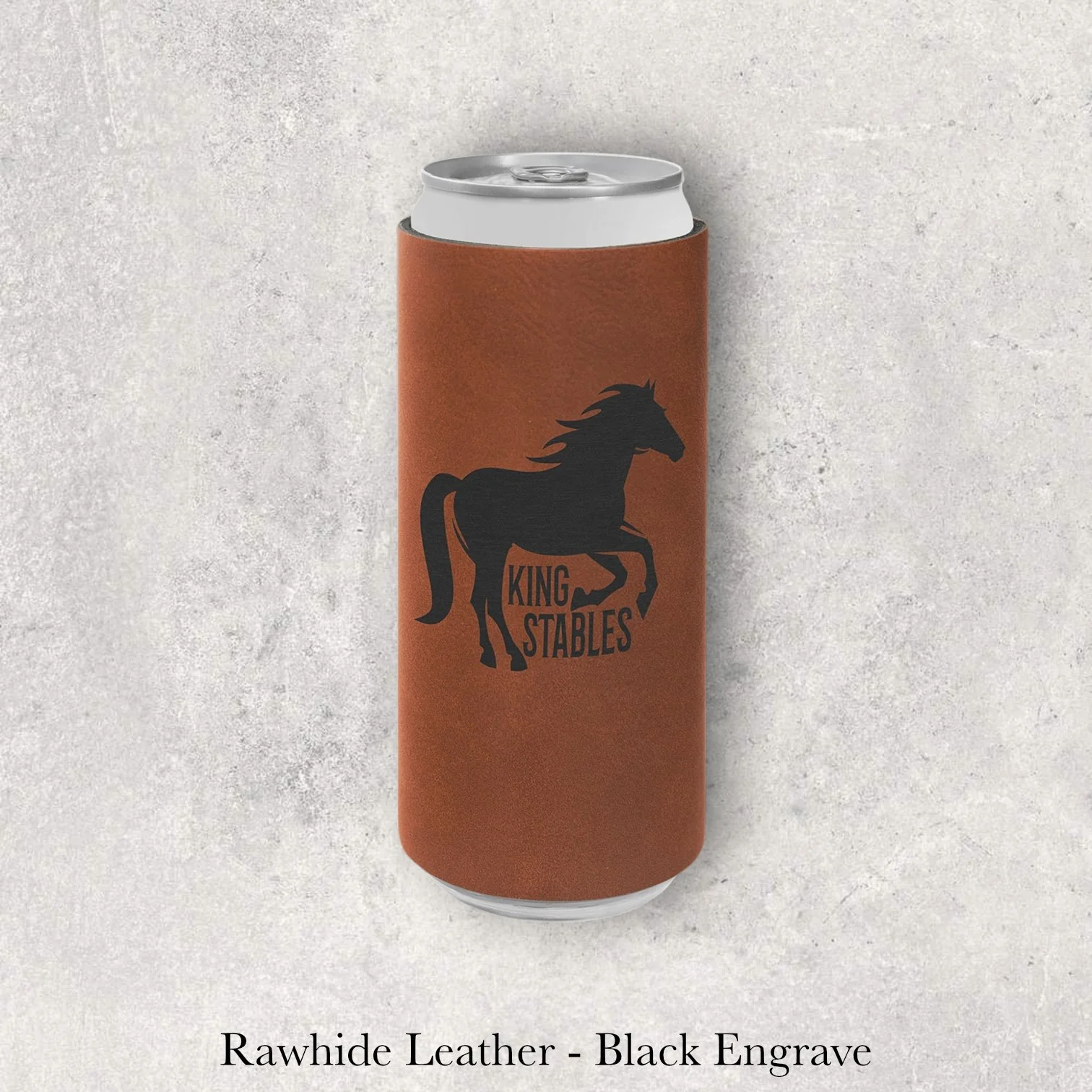 Rawhide leather slim can coozie with black laser-engraved King Stables horse logo, engraved by Lazeric