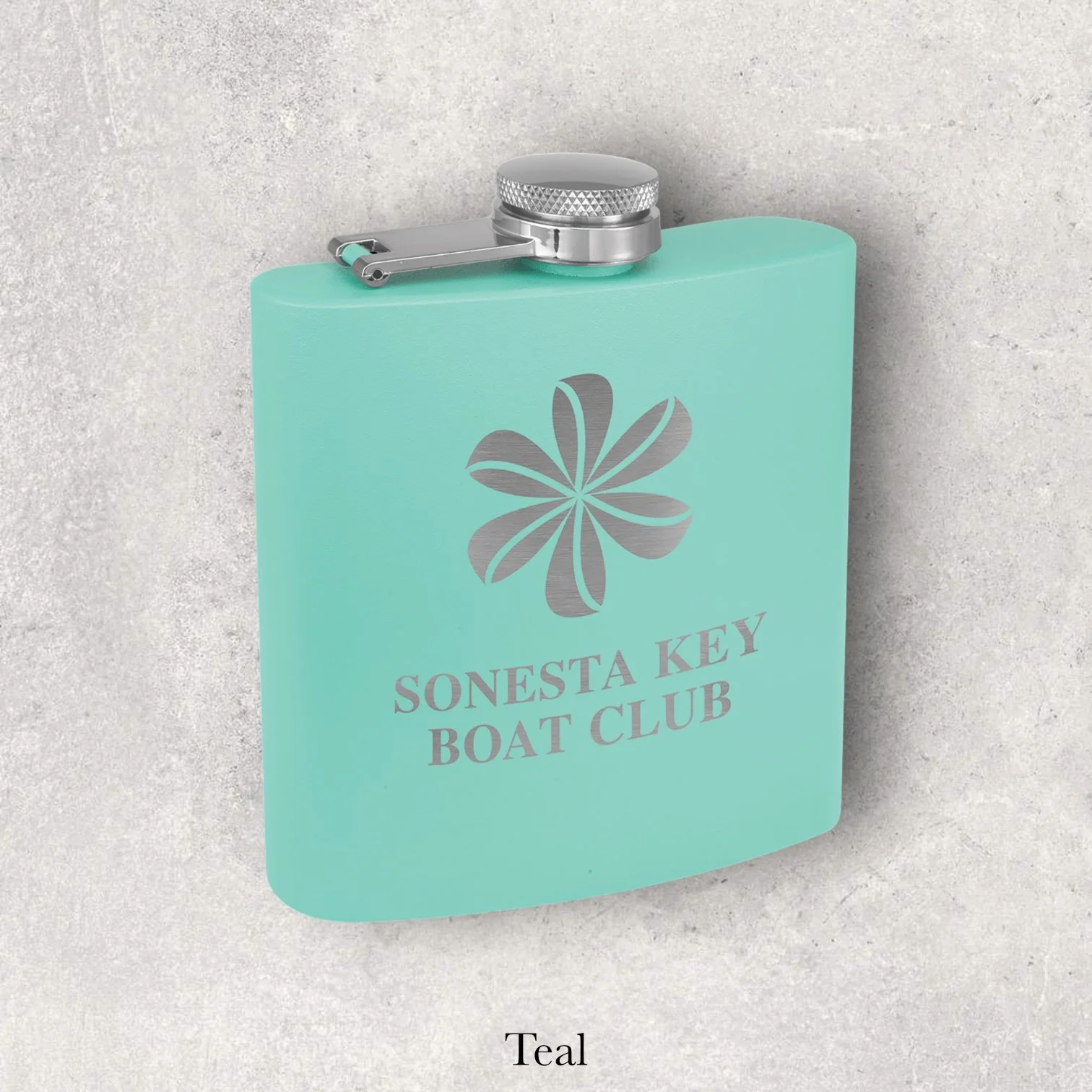 Teal 6oz metal flask engraved with Sonesta Key Boat Club logo, engraved by Lazeric