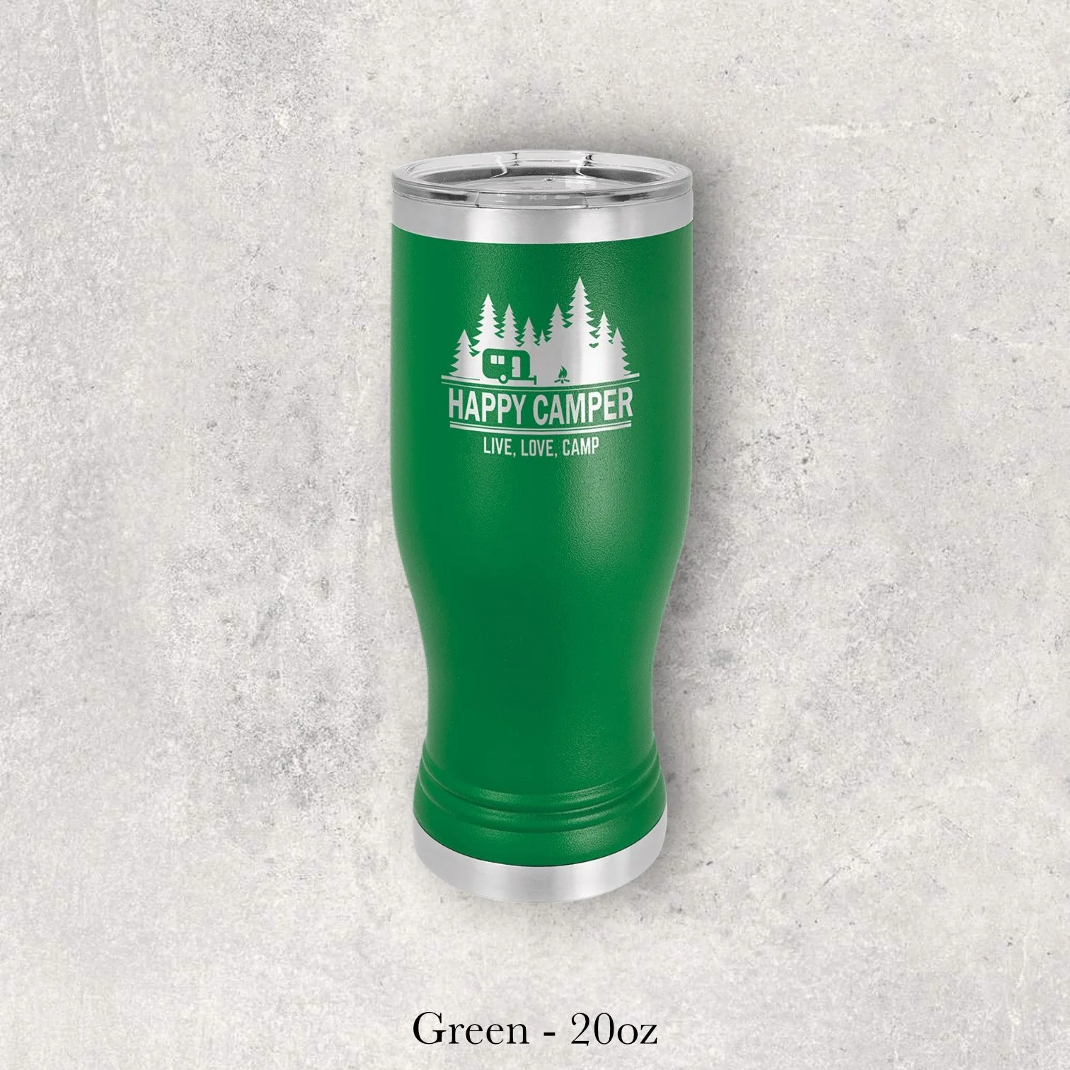 Green 20oz pilsner-style tumbler engraved by Lazeric with a “Happy Camper – Live. Love. Camp.” design.
