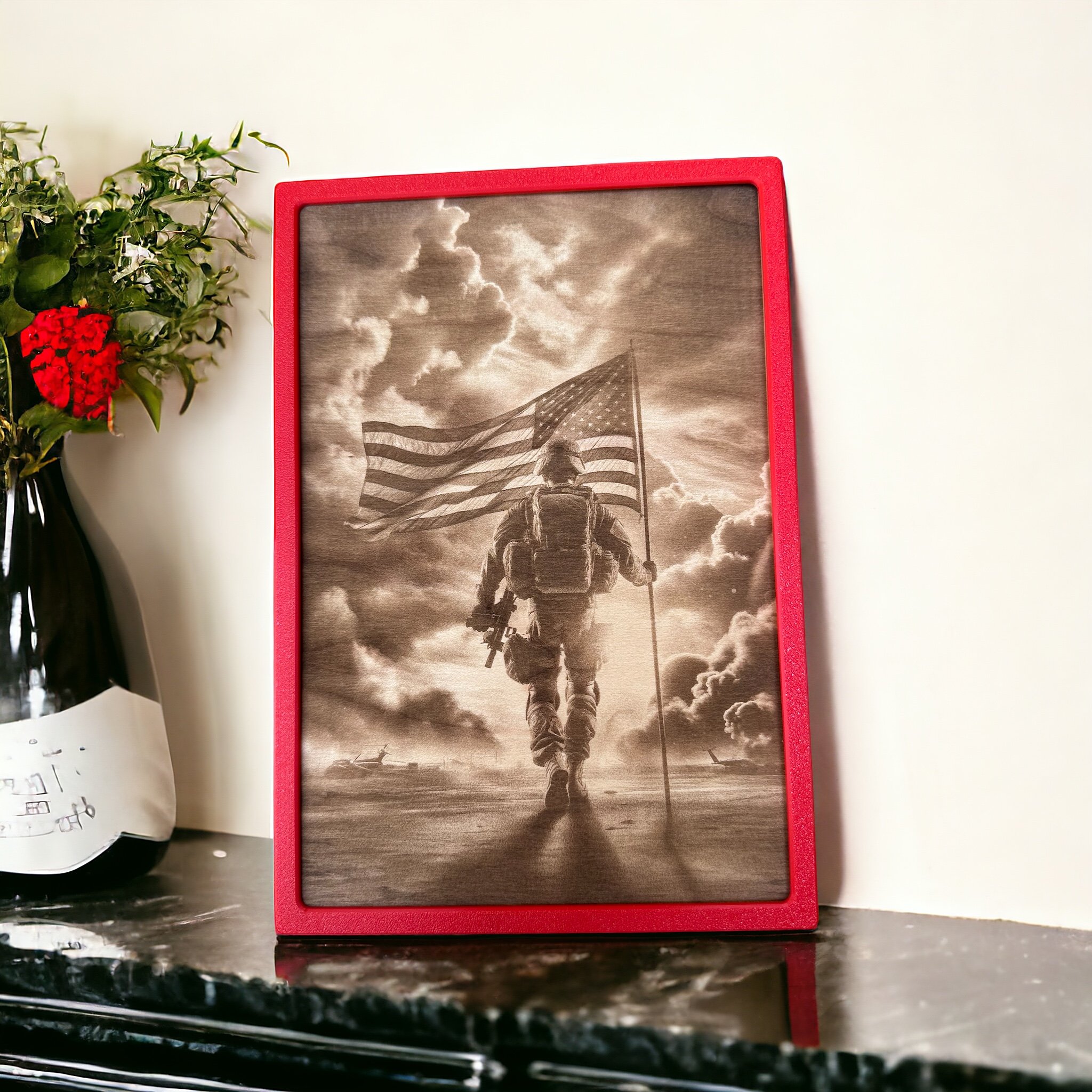 A laser-engraved wooden plaque shows a detailed image of a soldier walking forward while holding an American flag, silhouetted against a dramatic sky filled with clouds and light rays. The soldier carries tactical gear and a rifle, with military heli