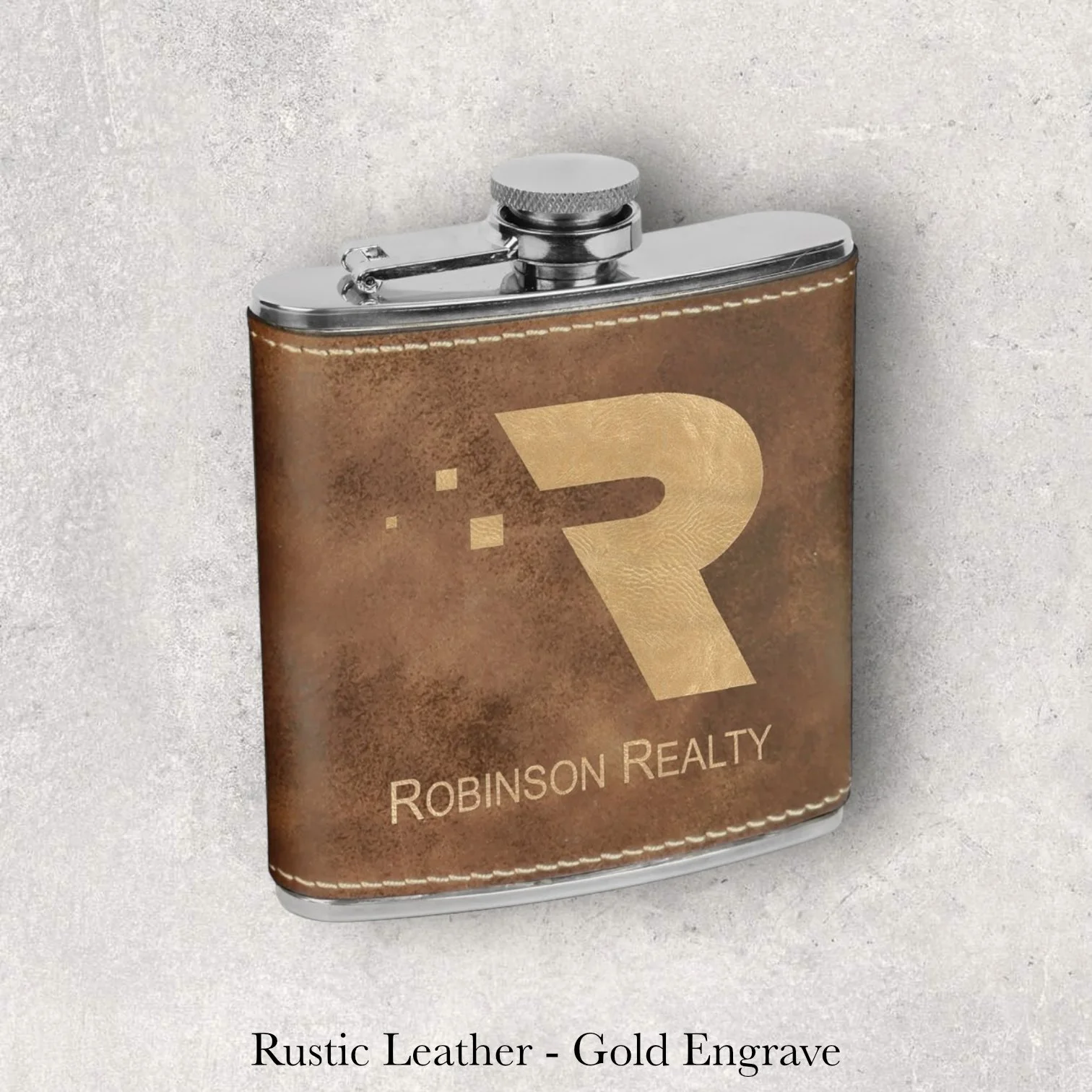 Rustic leather 6oz flask with Robinson Realty logo, gold laser engraving, engraved by Lazeric