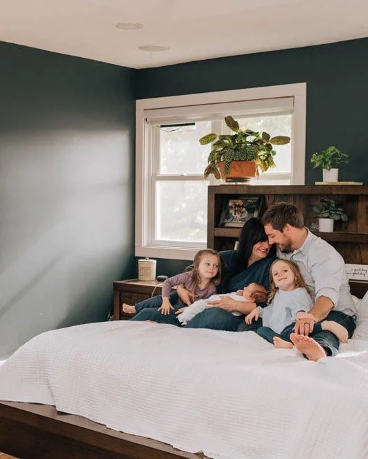 Every time I photograph a family at home, I think about how future you will feel looking at these.
The nursery you spent months preparing.
The way you held them when they were brand new.
The pieces of life scattered around the room because everything