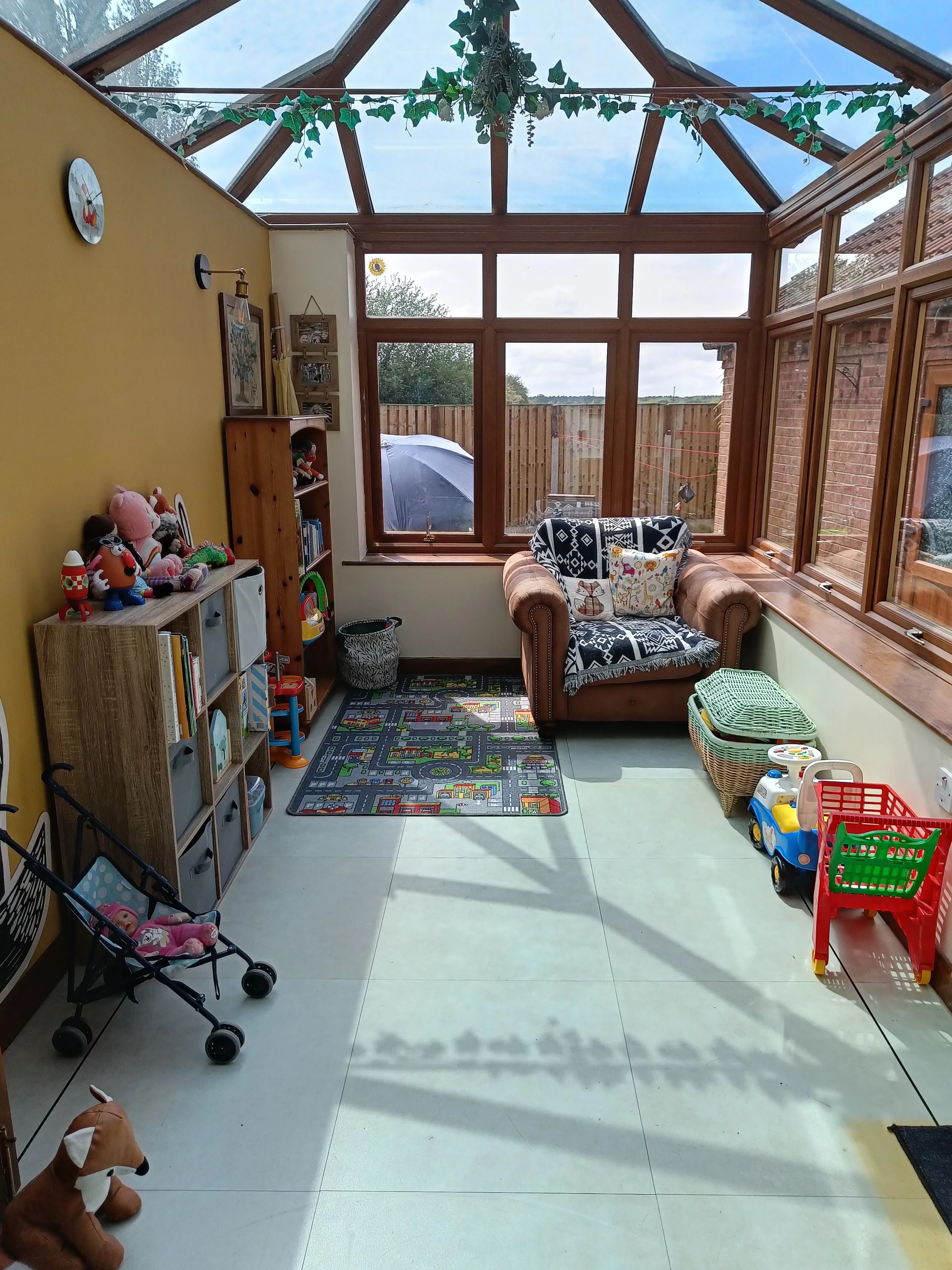 professional decluttering organising York - a tidy play room with book and toy storage
