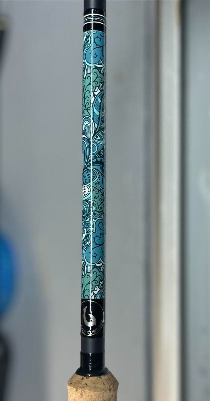 decorative fishing rod handle with blue patterns