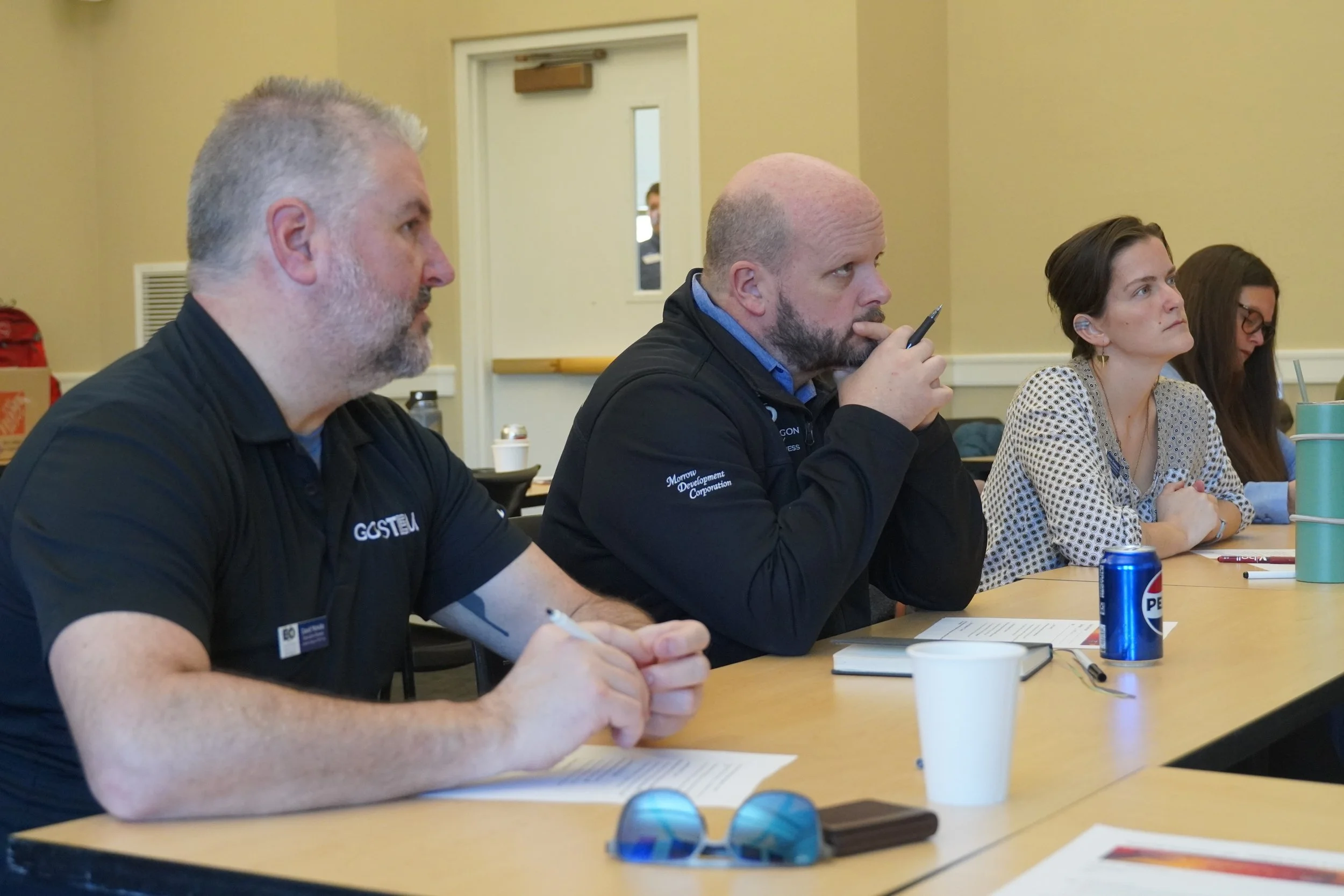 Judges at the 2026 EO Innovation Jam listen to the teams pitch their ideas