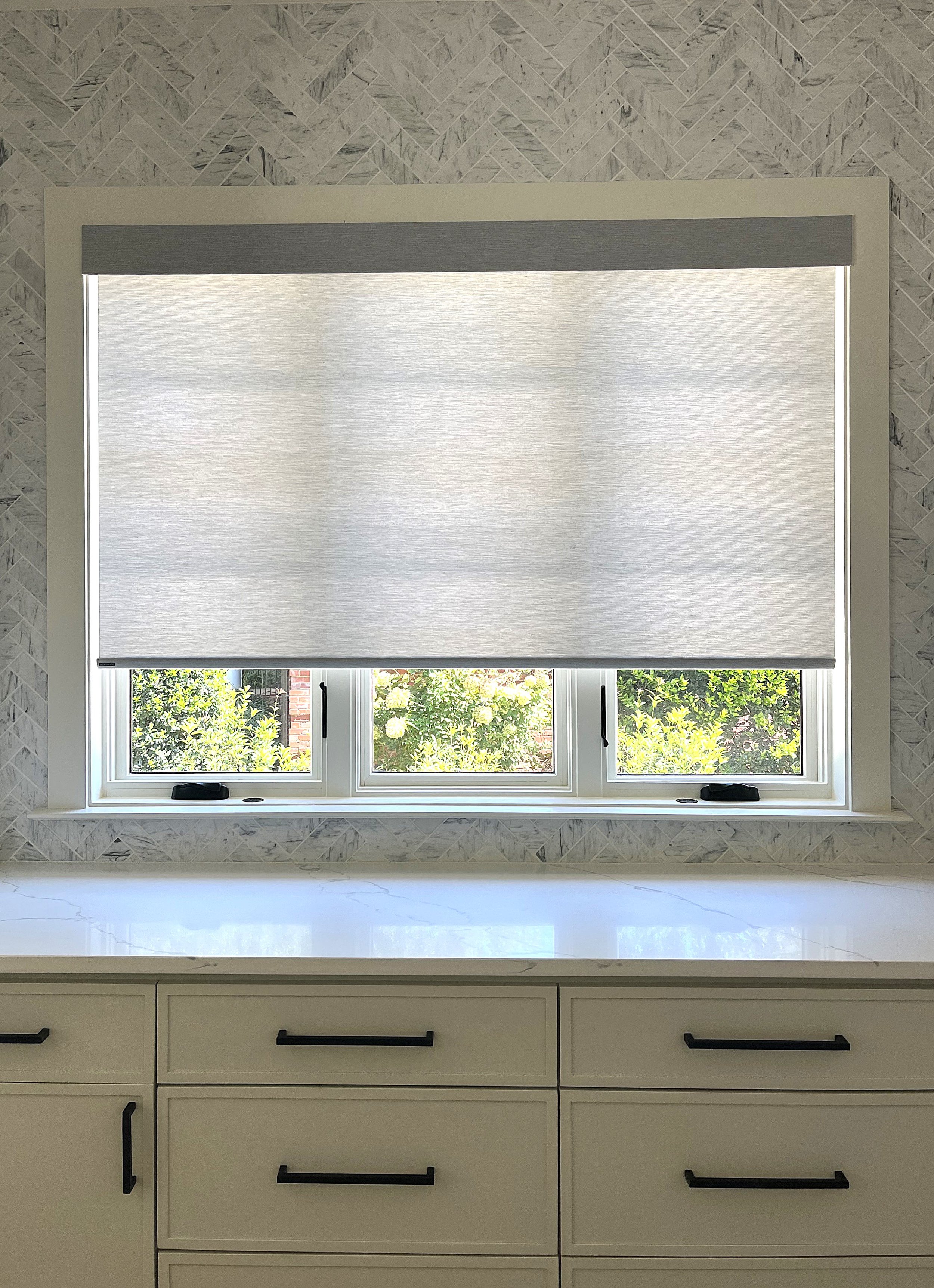 custom motorized light filtering roller shades for luxury kitchen in Charlotte, NC home