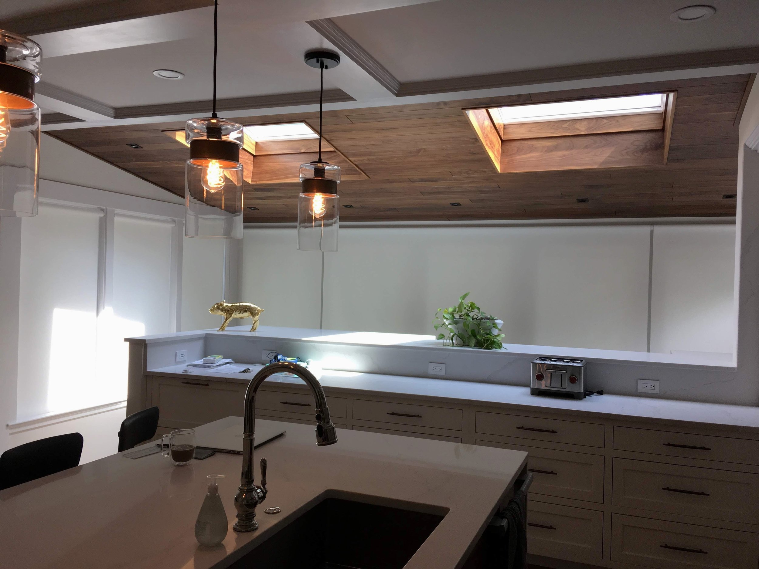 custom lutron motorized roller shades for modern kitchen in Lake Norman, NC home