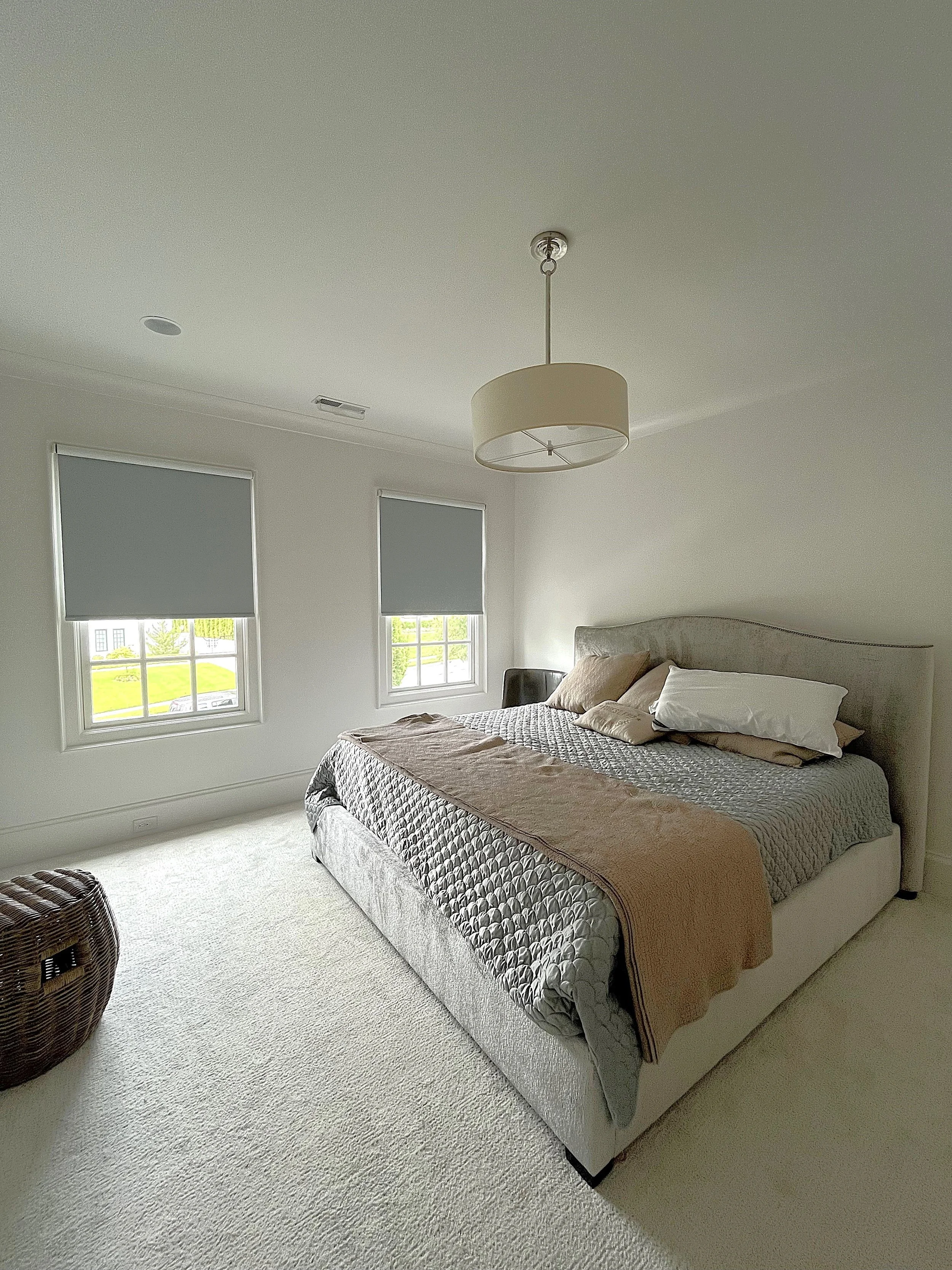 custom room darkening motorized roller shades for guest room in Charlotte, NC home