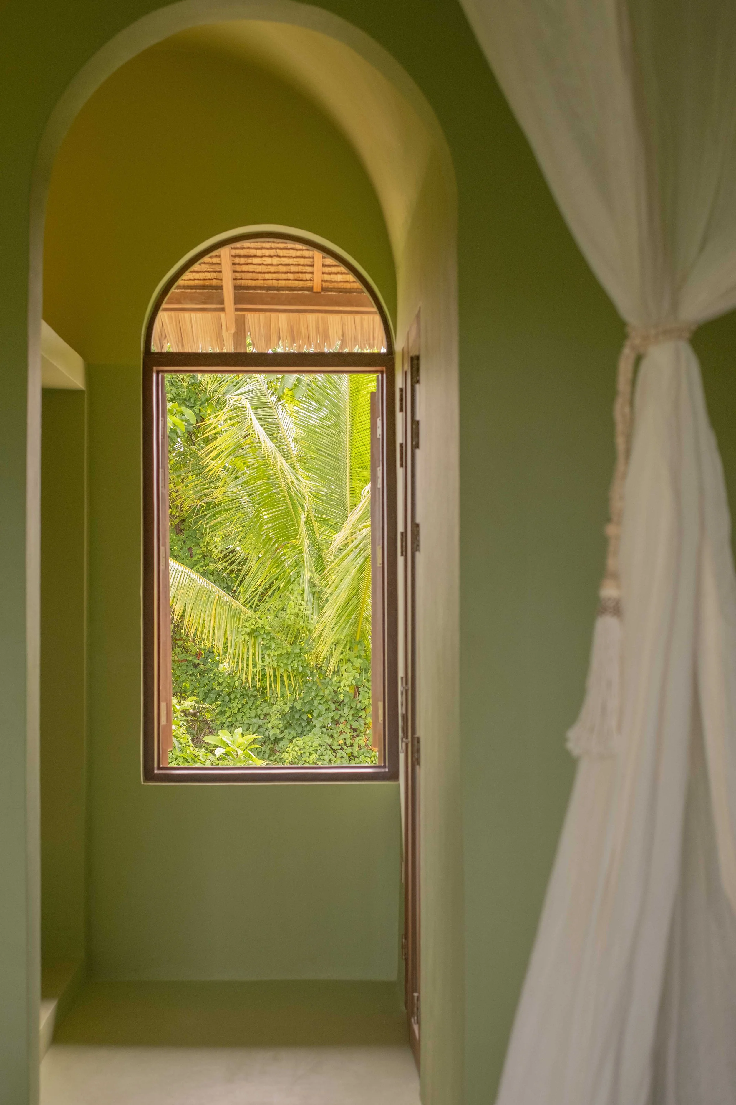 schoenhouse-villa-siargao-couple-suite-tropical-window-view.jpg