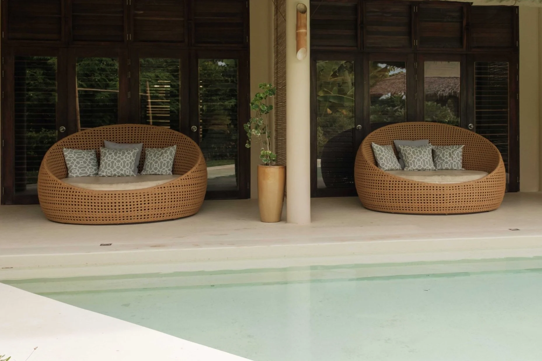 Family Poolside lounge chairs beside the large swimming pool at schönhouse Villa Siargao.