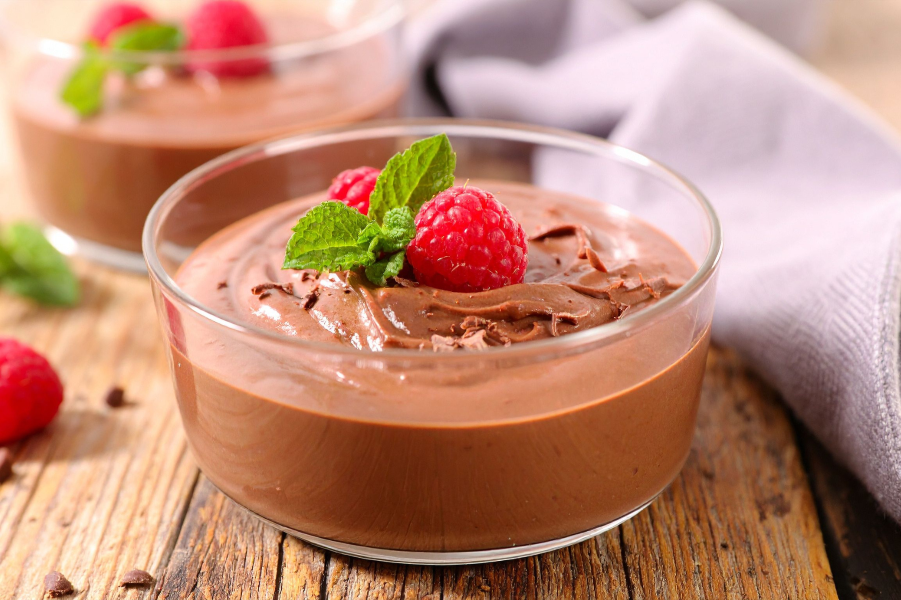 class bowl with chocolate tofu mousse and raspberry topping