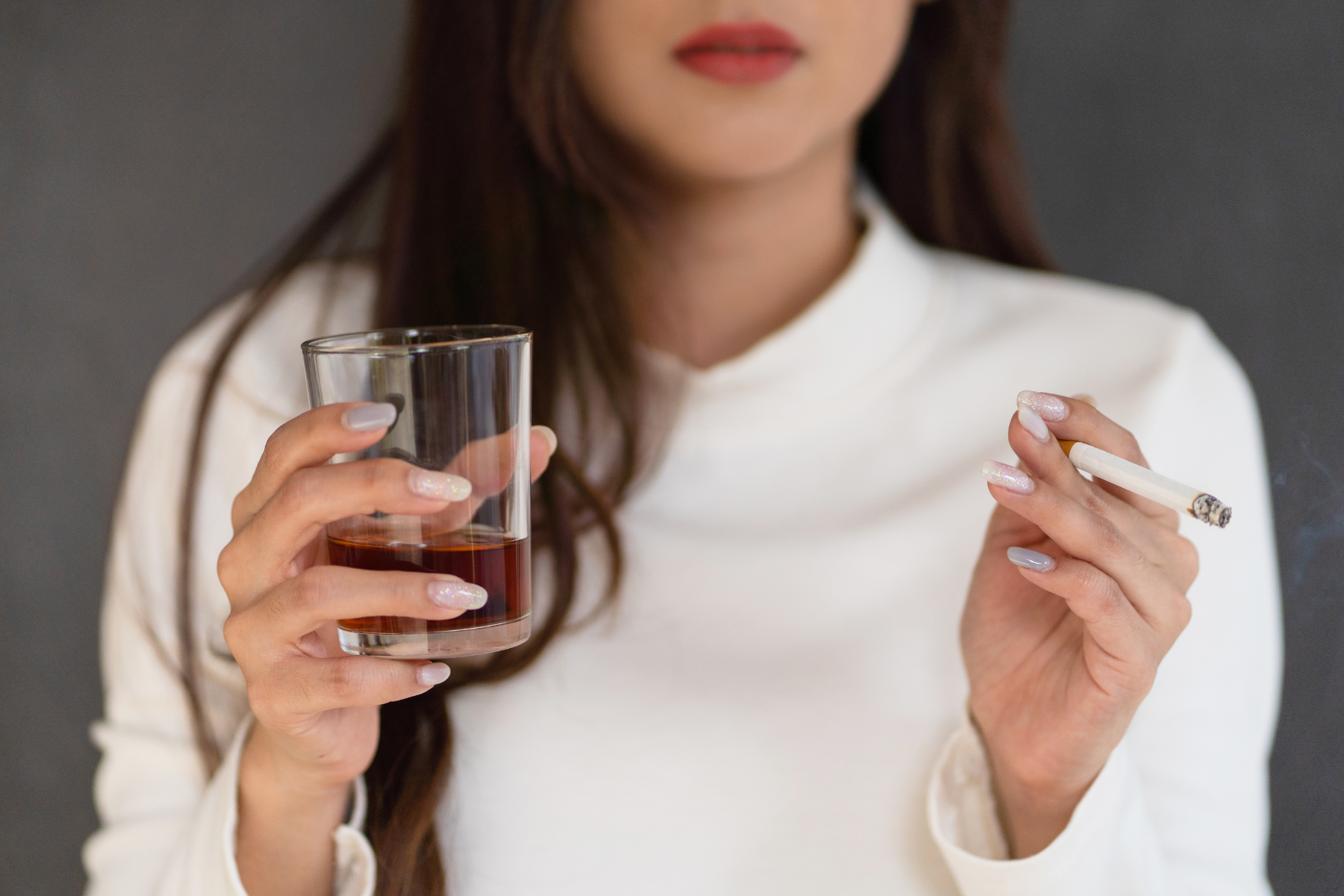 Women smoking with an alcoholic drink