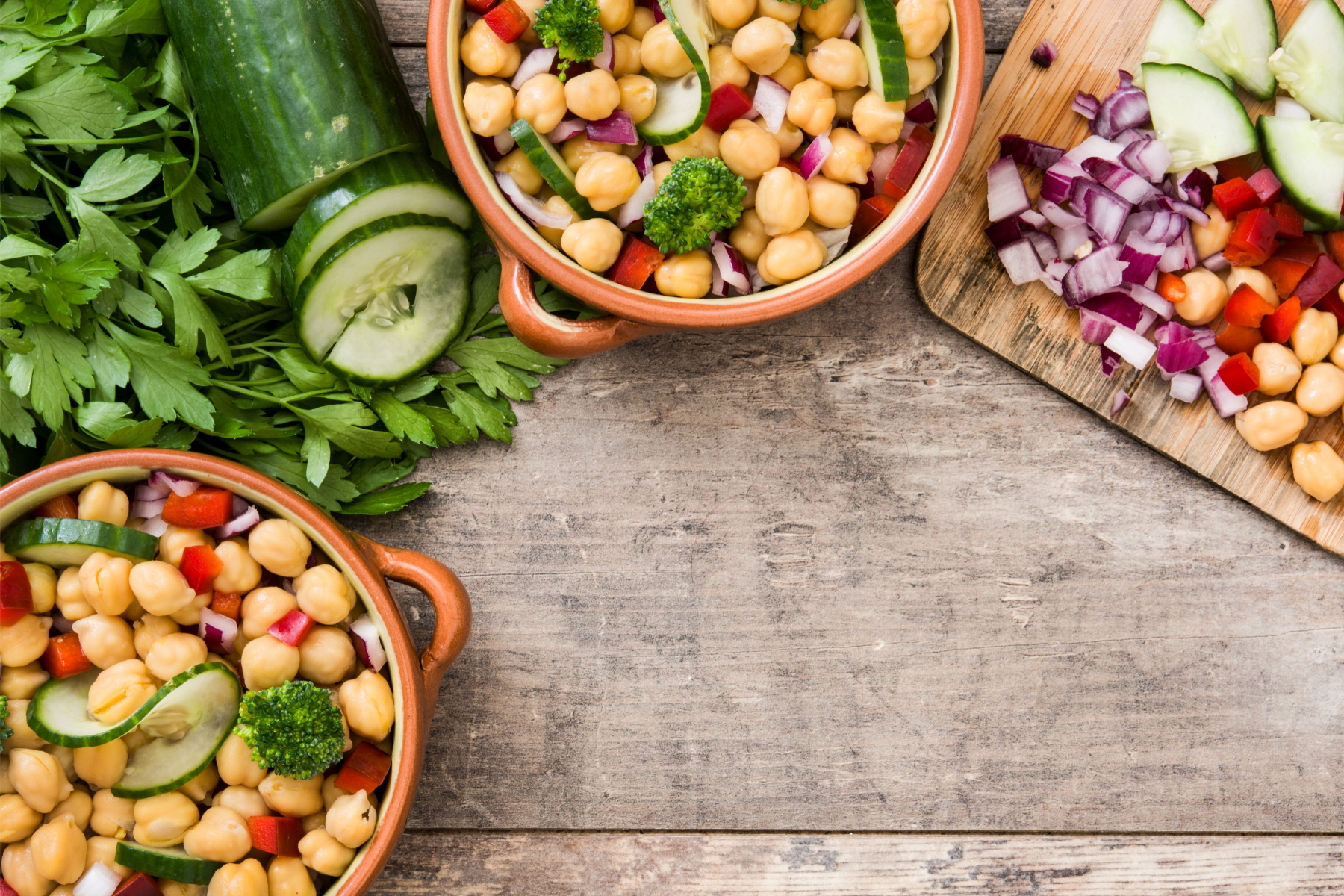 chickpea salad, with cucumber, tomatoes and onions in a bowel on the table