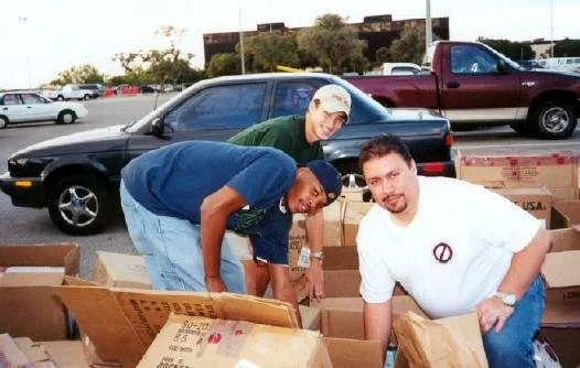 Brothers Lee, Dallas, and Kato, another alumni, during the food drive.