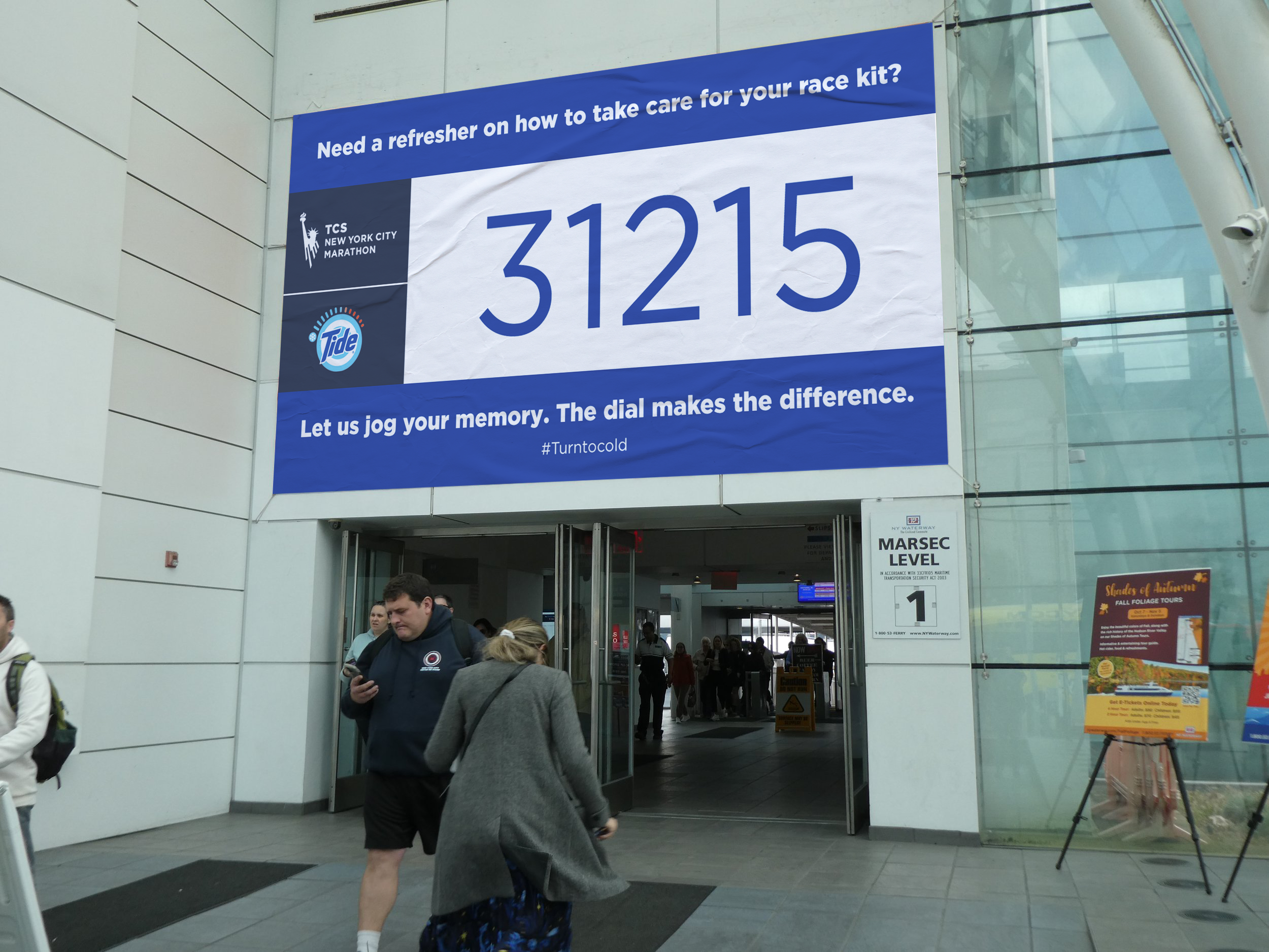 Event signage connecting Tide’s cold-wash impact to athletic milestones, reminding audiences that small changes add up.