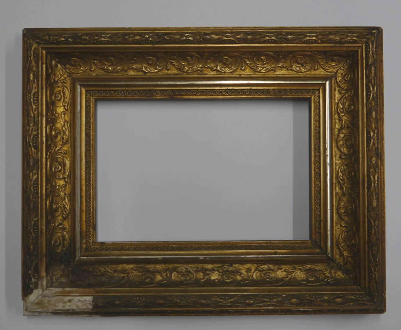 Ornate picture frame in need of restoration.
