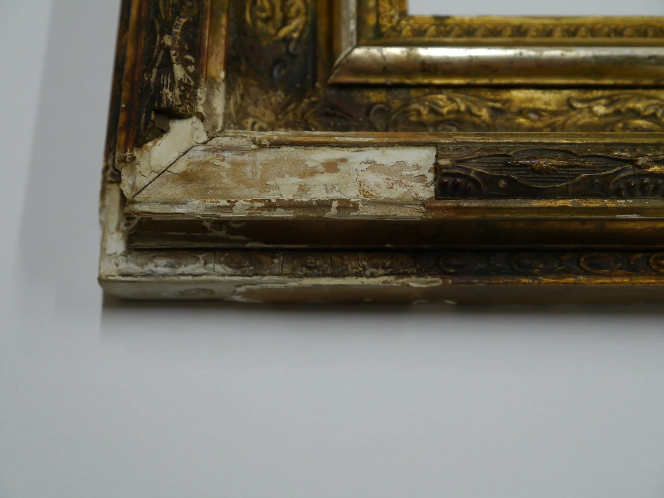 Ornate picture frame in need of restoration and repair.